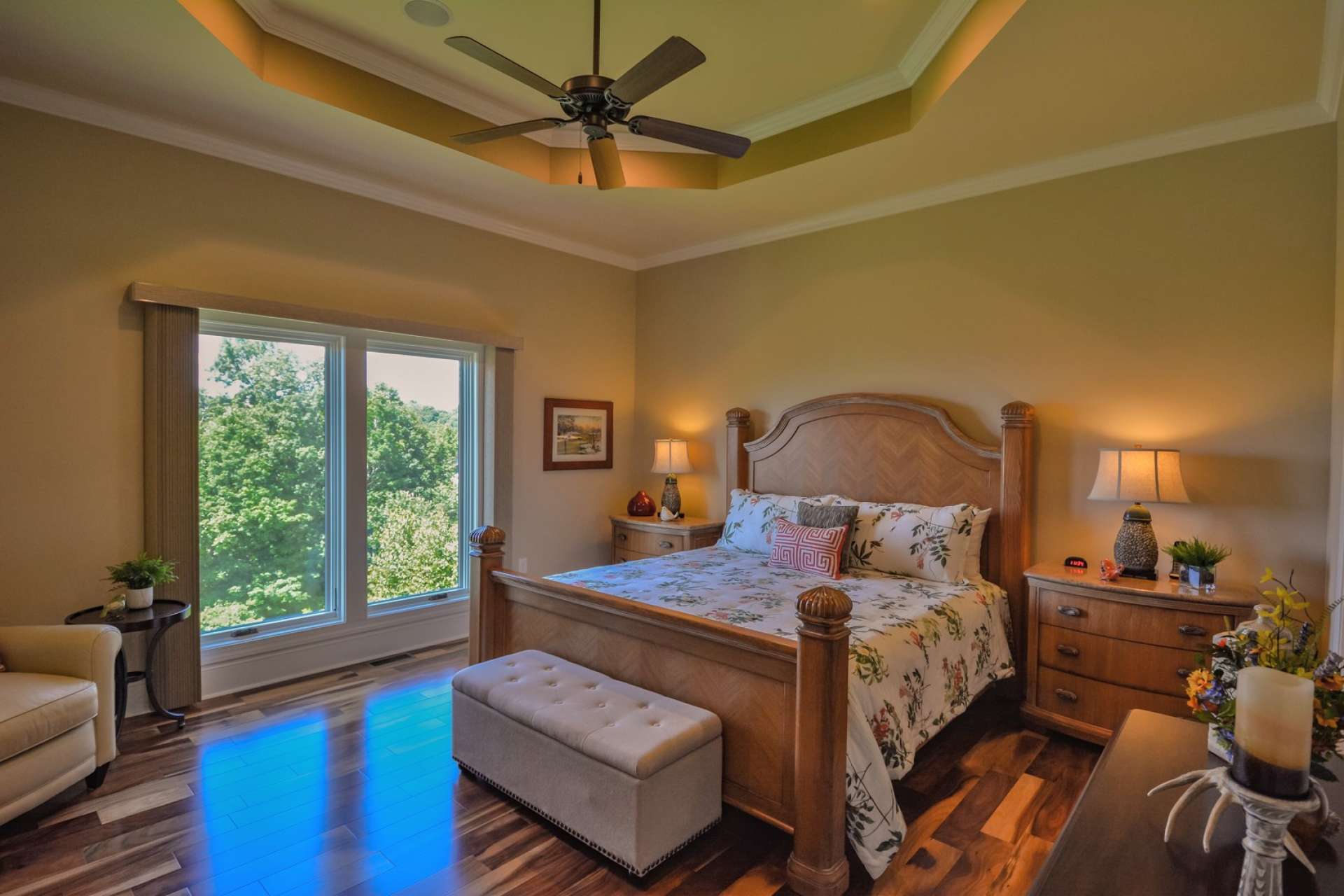 The magnificent master suite includes a trey ceiling and ceiling fan. Of course you'll find stunning views from the bedroom windows.