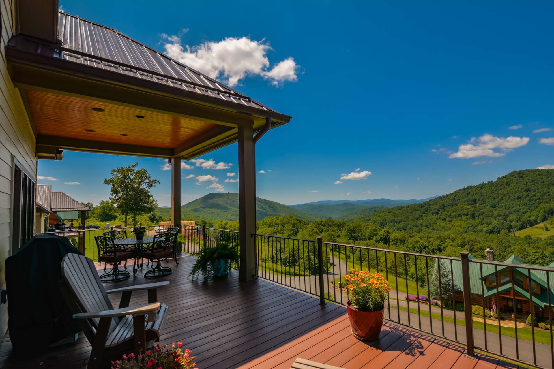 At the back of the home you may be too busy staring at the jaw-dropping view to notice the finely constructed Trex-type back decking and covered porch with built-in music system. What unbeatable spot for cook-outs and entertaining.