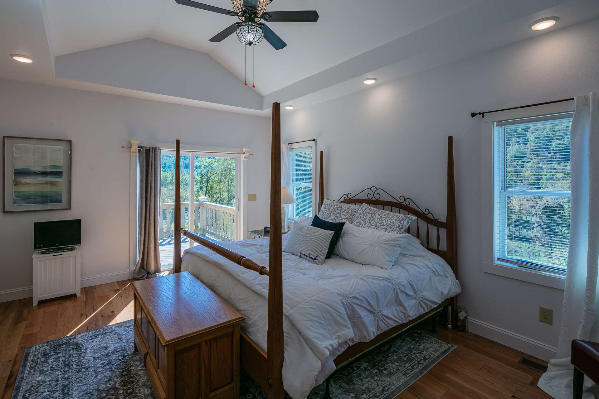 The master suite is located on the main level and offers a tray ceiling , private deck, huge walk-in closet and private bath.