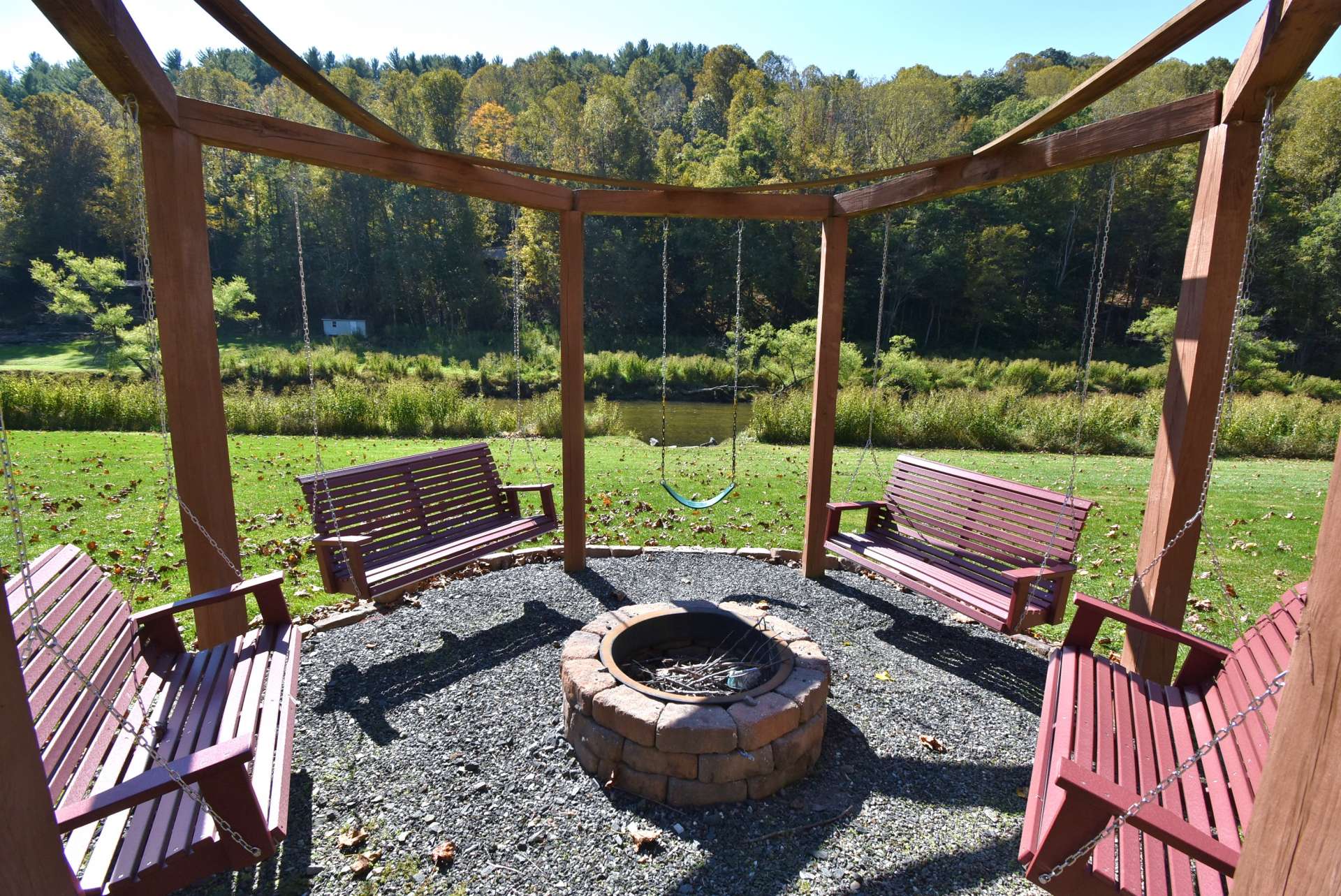 A stylish fire pit is the spot for s'mores and memories with friends and family with the sights and sounds of the river.