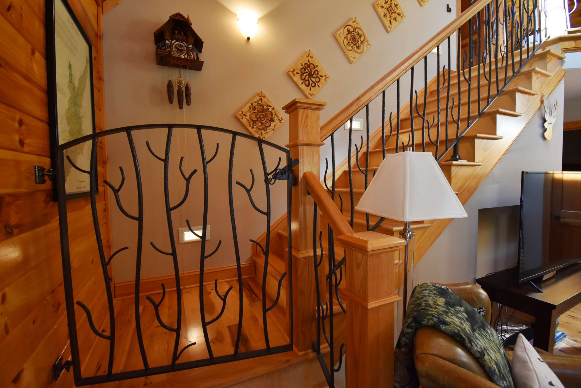 You'll love the custom railing with child/pet gates at the top and bottom of the stairs leading to the upper level.
