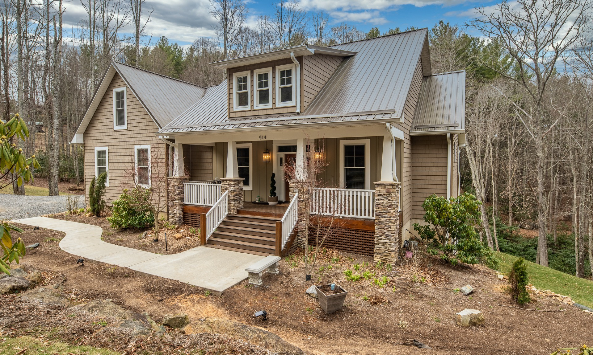 Designed and built with full-time living in mind, you will appreciate the low maintenance exterior including metal roof, high quality vinyl shakes and Hardie Plank board & batten siding and Trex decking.