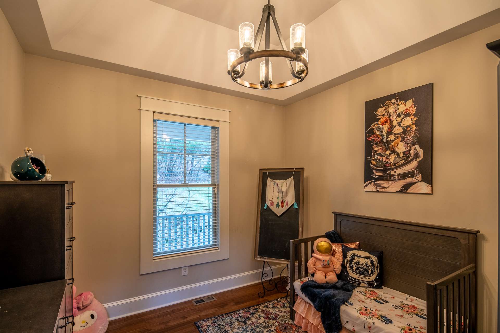 The dining room is adjacent to the kitchen and features a tray ceiling. The owner currently uses this room as a bedroom.