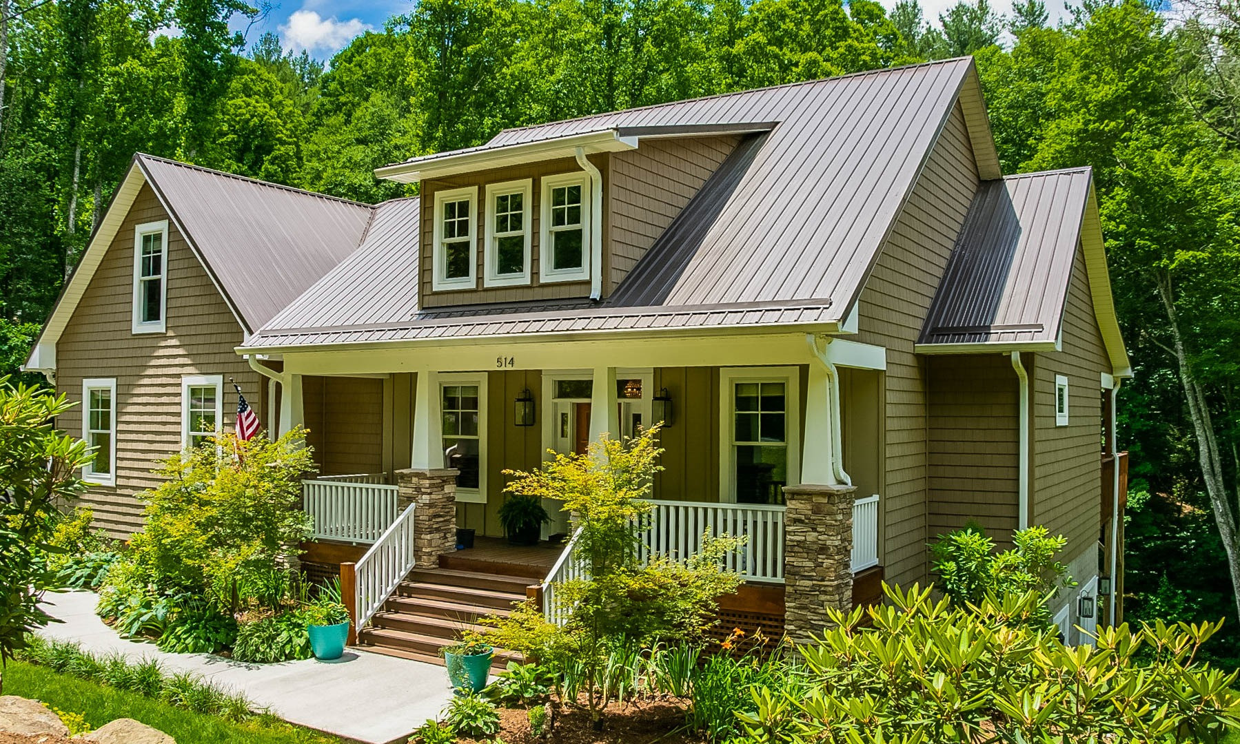 Designed and built with full-time living in mind, you will appreciate the low maintenance exterior including metal roof, high quality vinyl shakes and Hardie Plank board & batten siding and Trex decking.