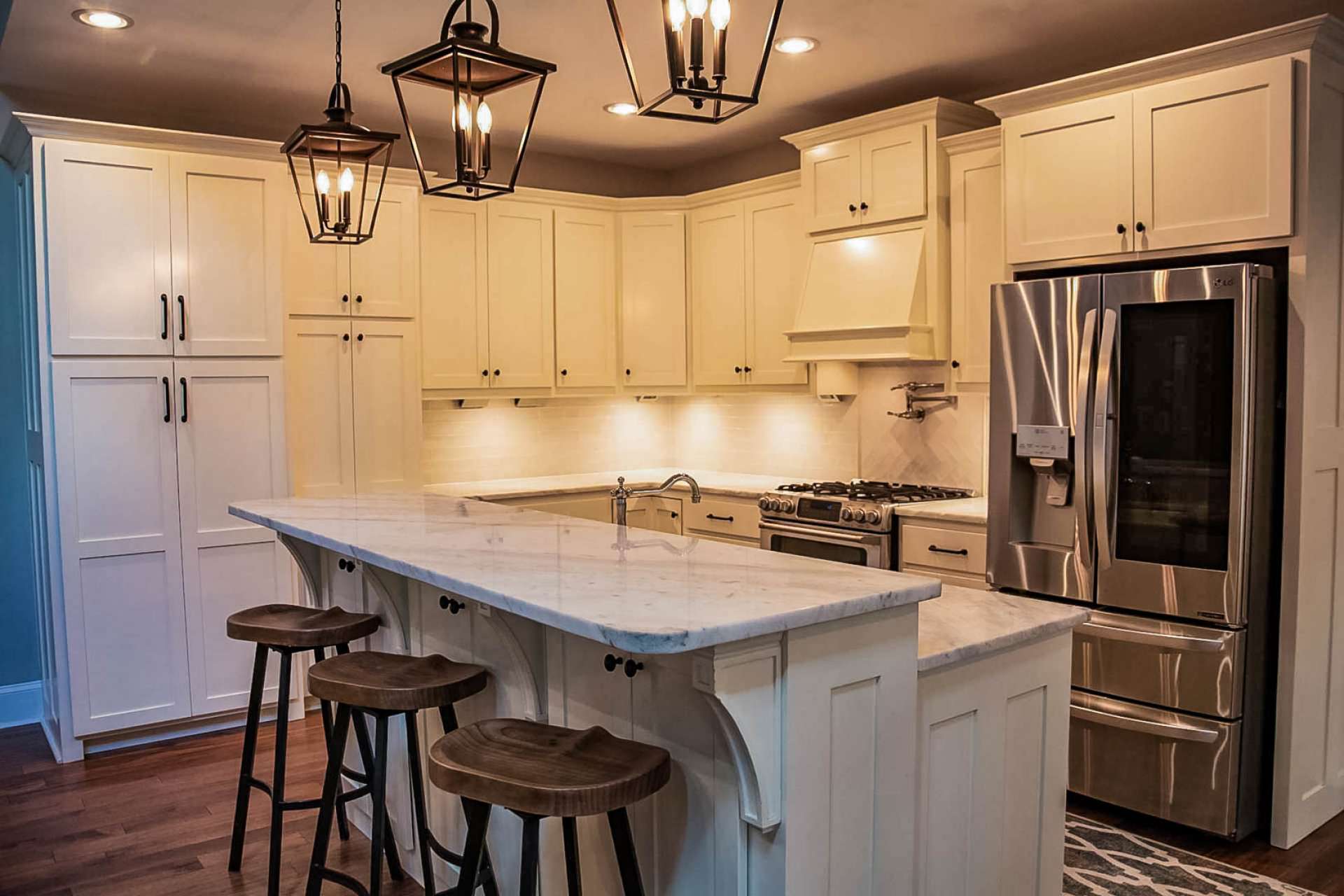 Enjoy custom white cabinetry designed to hide all your small appliances, granite counter tops, stainless appliances including gas range with dual fuel double oven and pot filler and Legrand under cabinet lighting system.