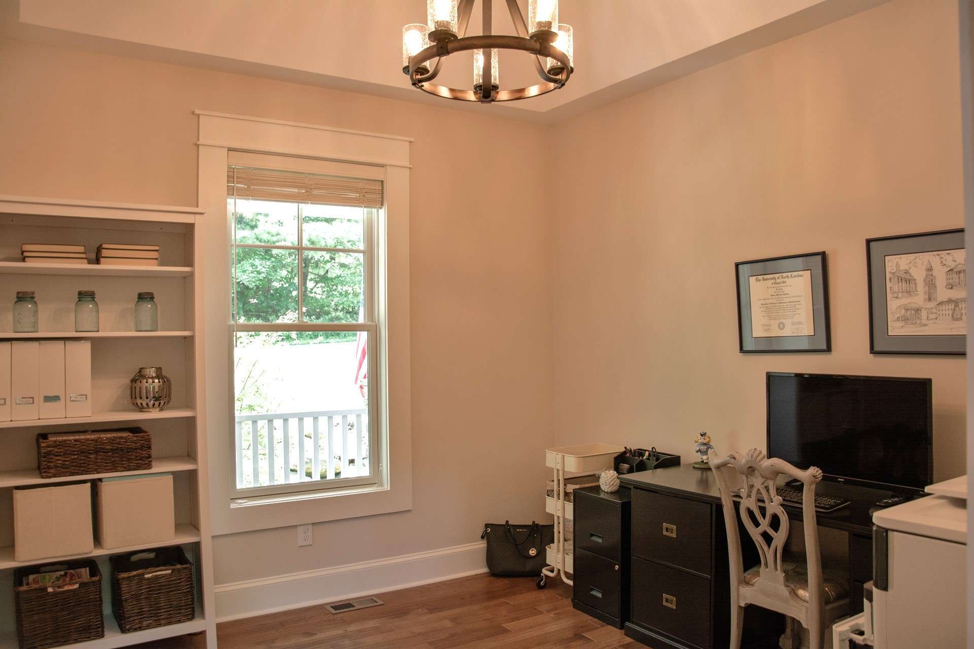 The dining room is adjacent to the kitchen and features a tray ceiling. The owner currently uses this room as an office.