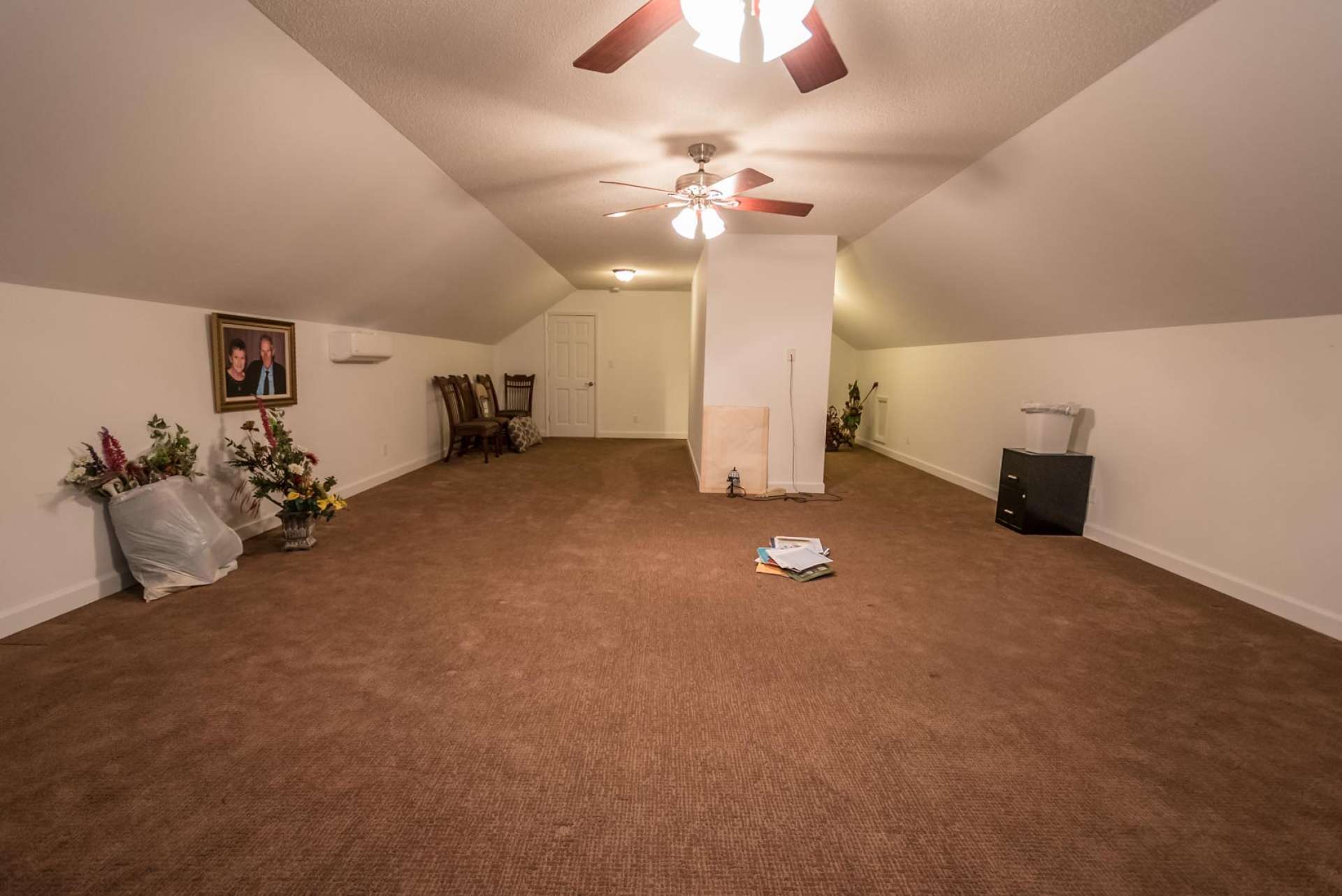 The upper level offers a large bonus room with many options, such as a play room, studio, or additional sleeping space.