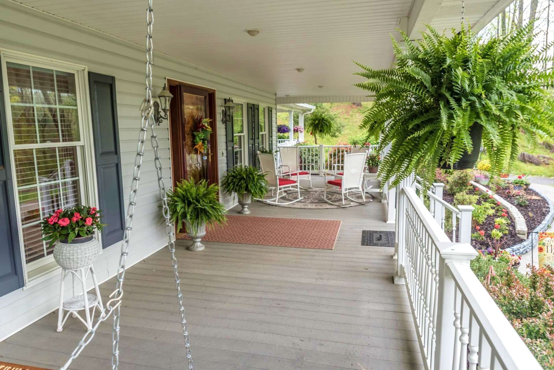 Enjoy the views of the countryside and creek from the covered rocking chair front porch.