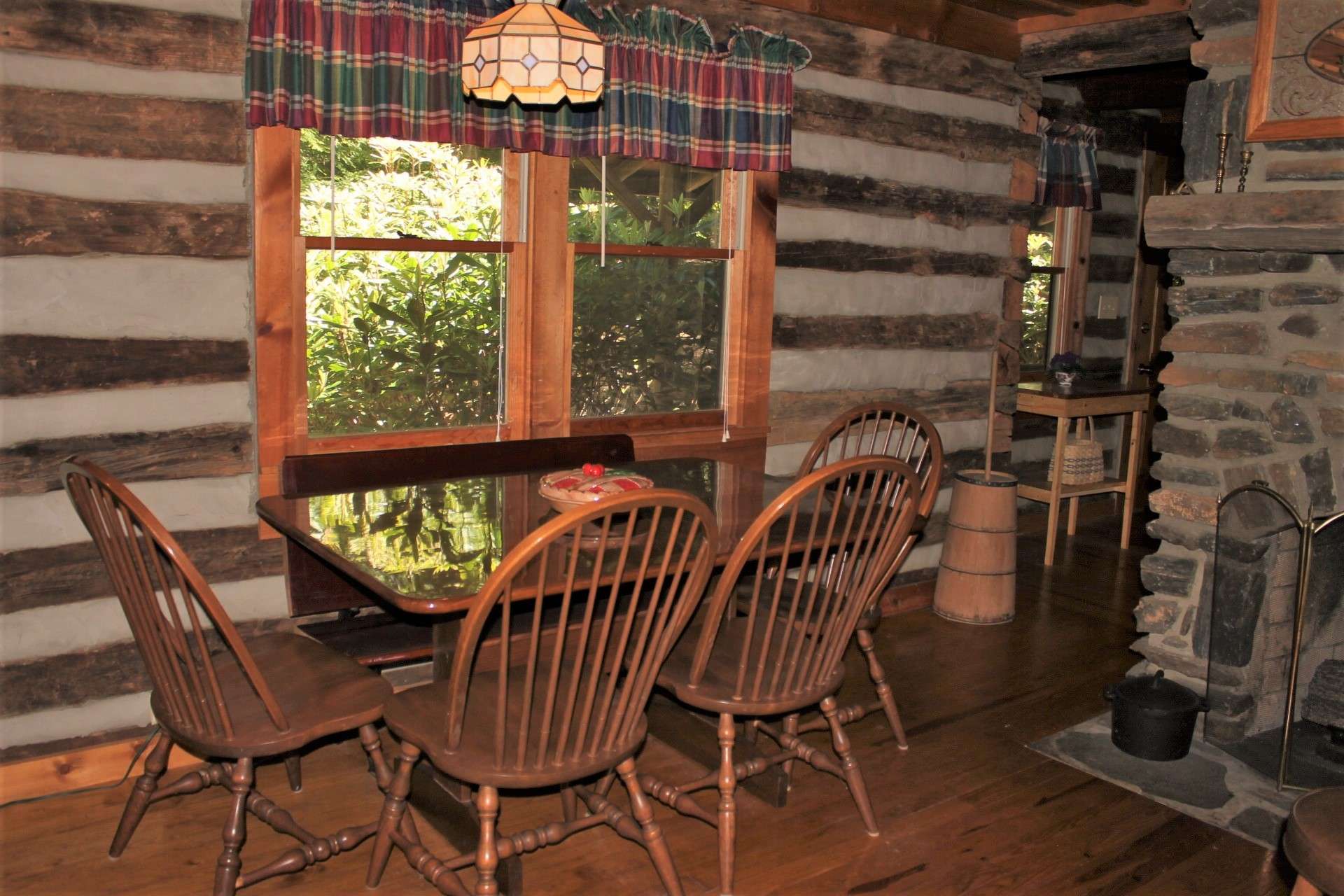 The dining area offers ample space to have a large family feast with views of the lovely wooded setting.