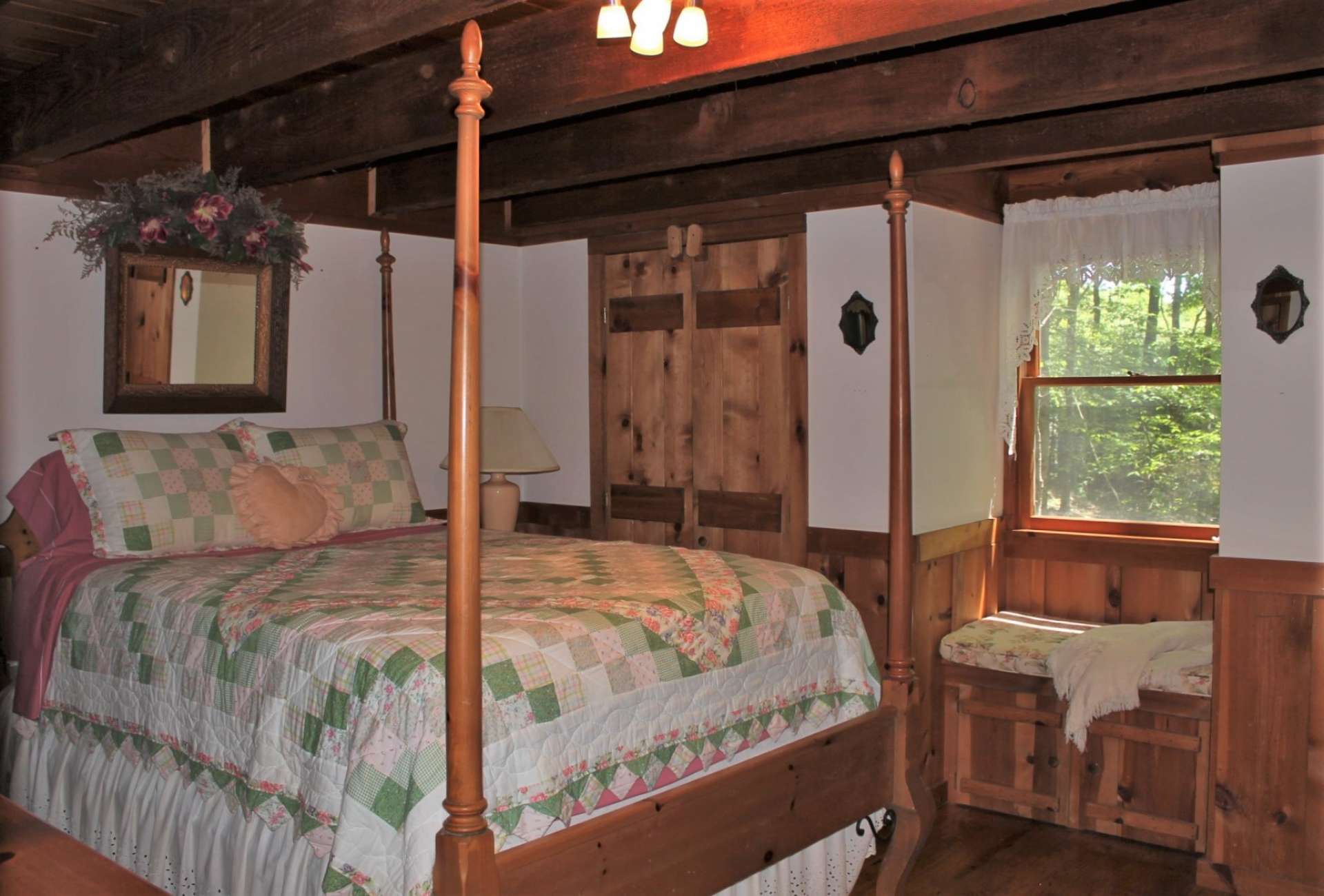 The light-filled master bedroom is situated on the other side of the family room with two closets and window seat with storage.