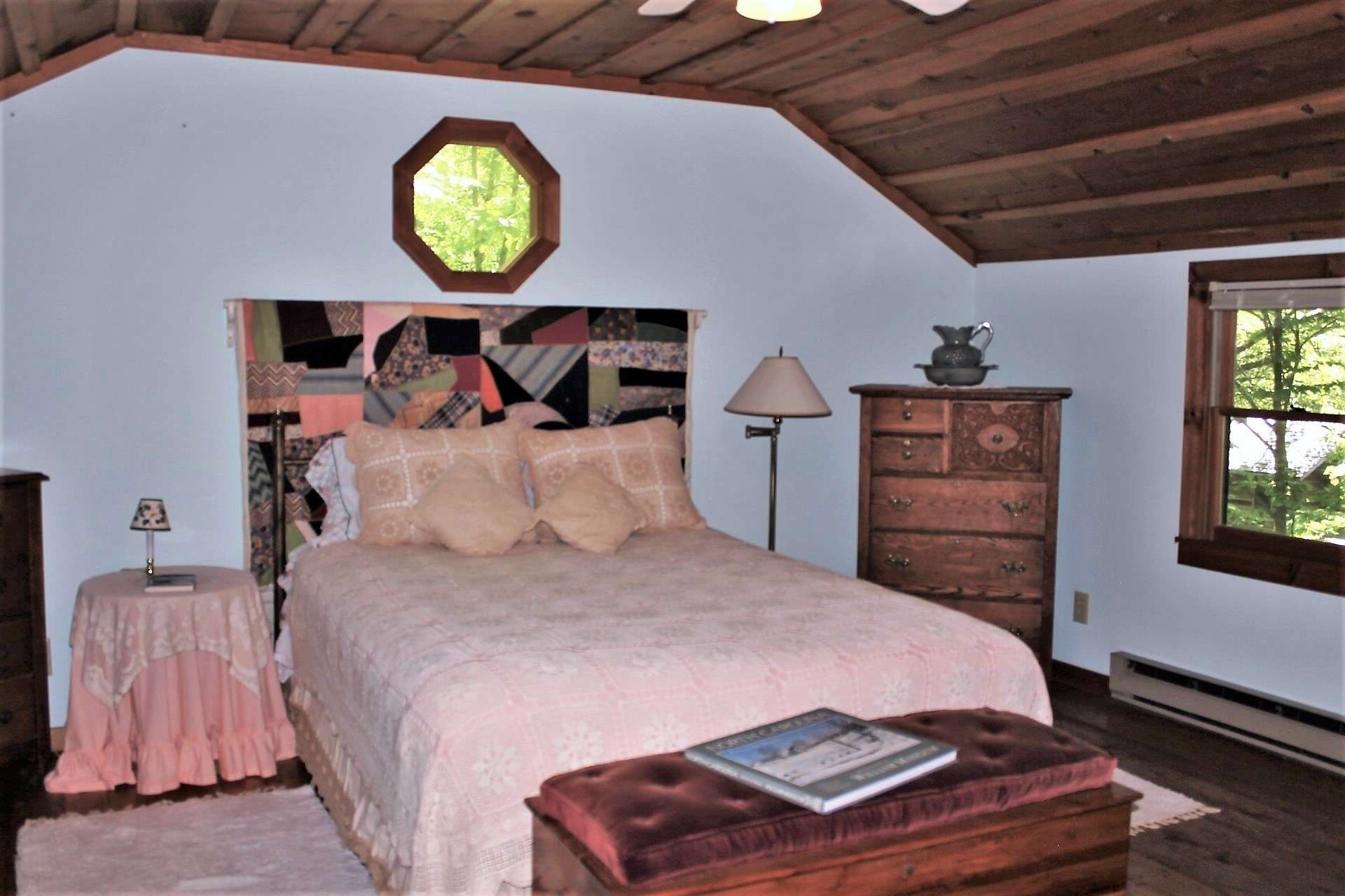 Overnight guests will enjoy sleeping in this charming bedroom while falling asleep to the soothing sound of the creek