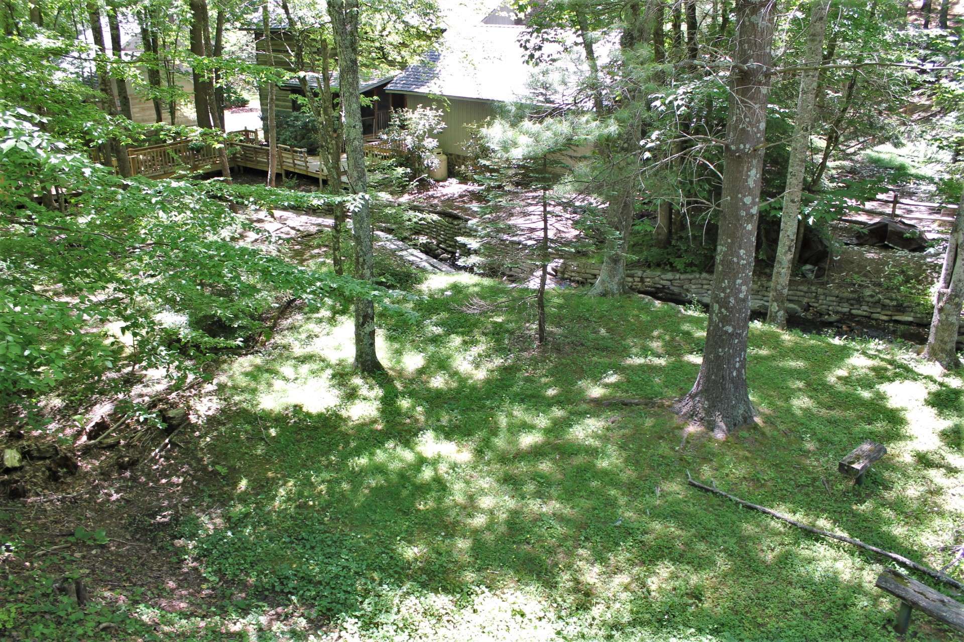 View from the sunroom looking down to the backyard and creek.