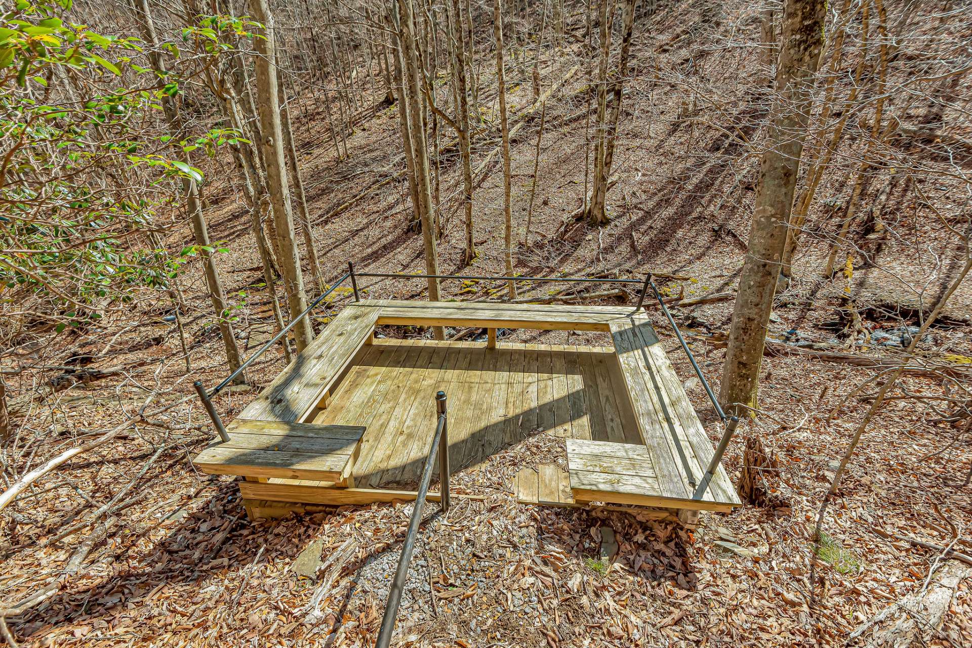 The spacious deck makes a great entertaining spot by the creek, perfect for chilling with your favorite beverage and enjoying the tranquil sounds of flowing water.