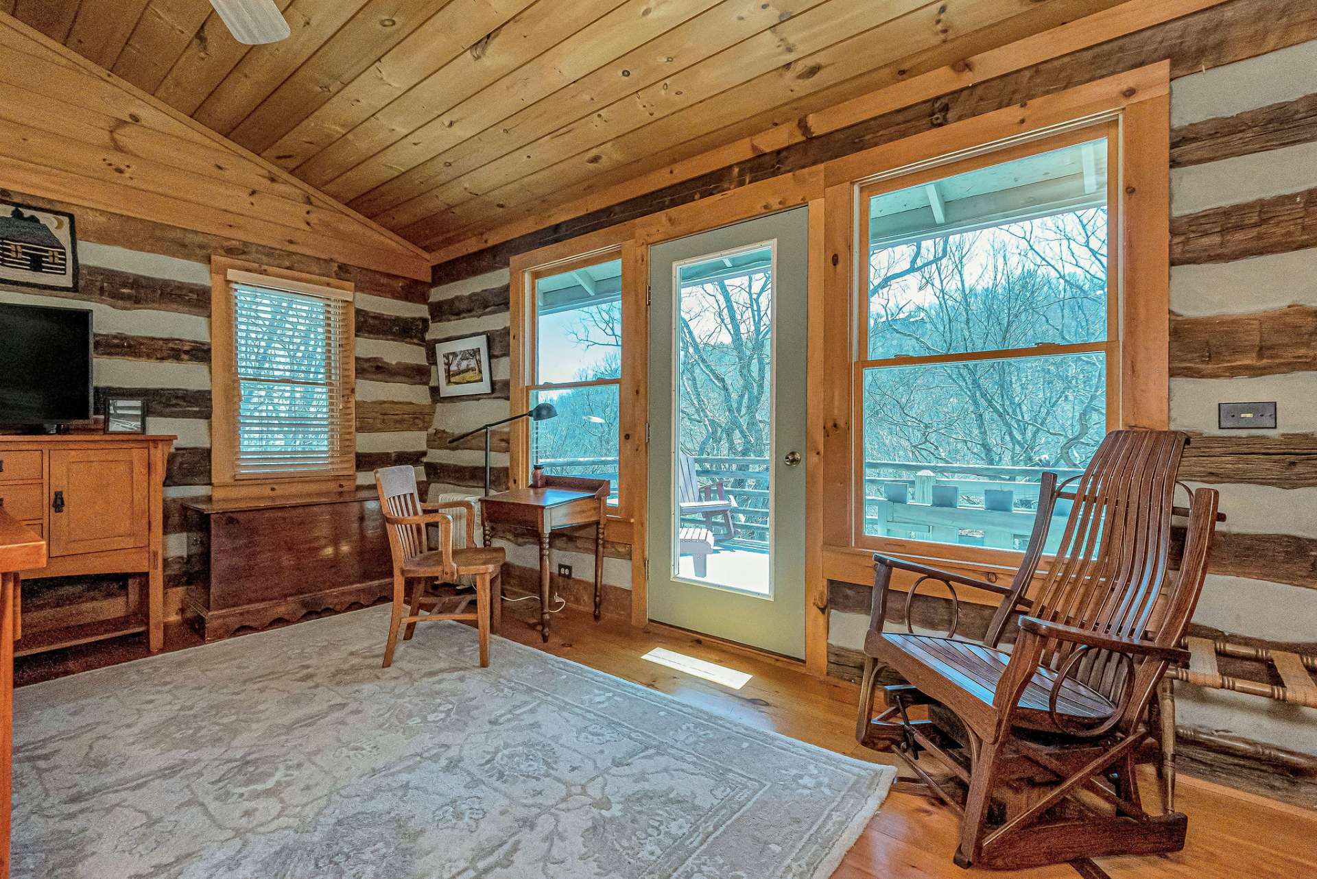 The door and abundant windows allow natural light to flood the room to get your day started. Convenient deck access allows one to enjoy mountain top living and the starry nights of the open sky.
