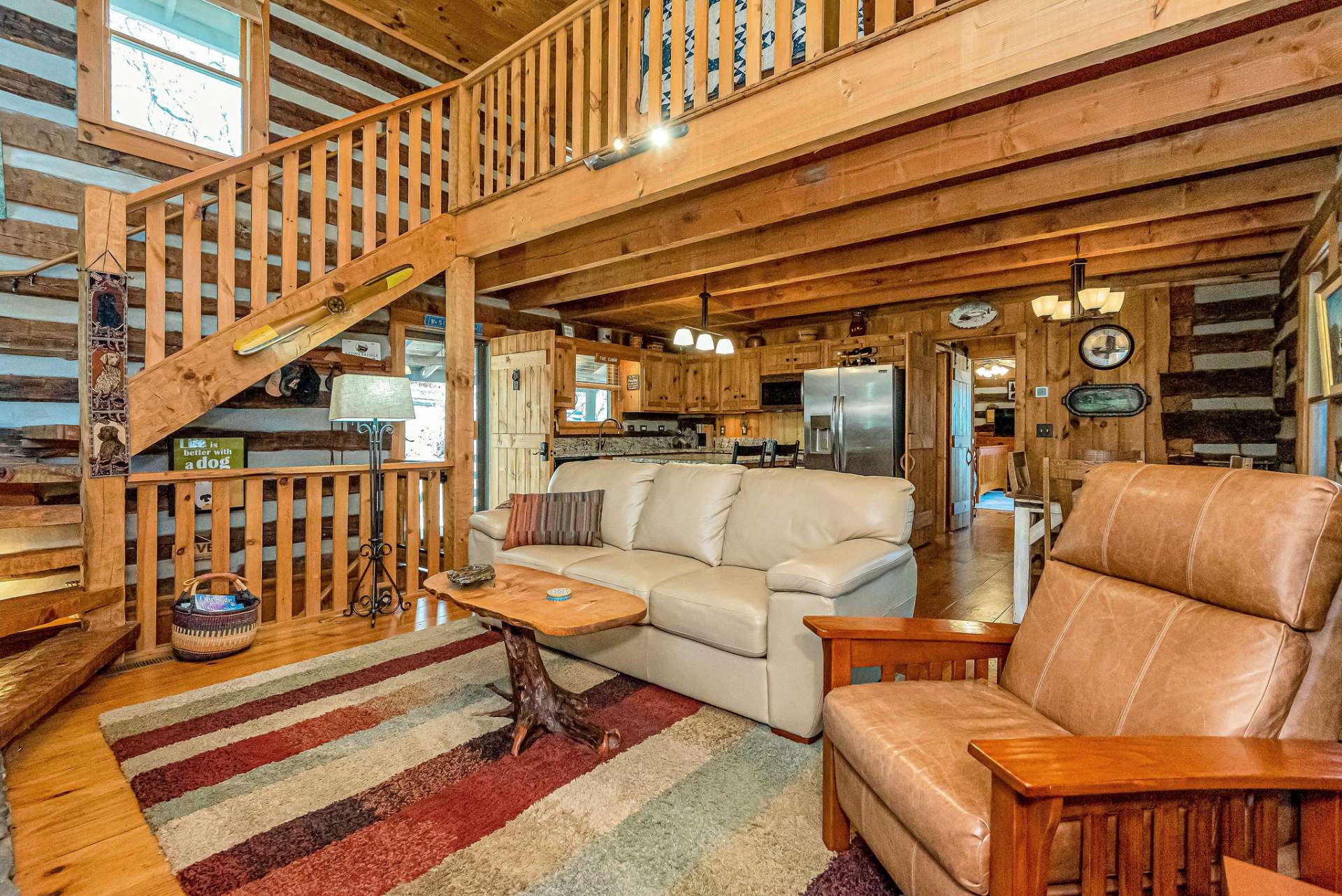 The hand-hewn staircase leads to the loft area.