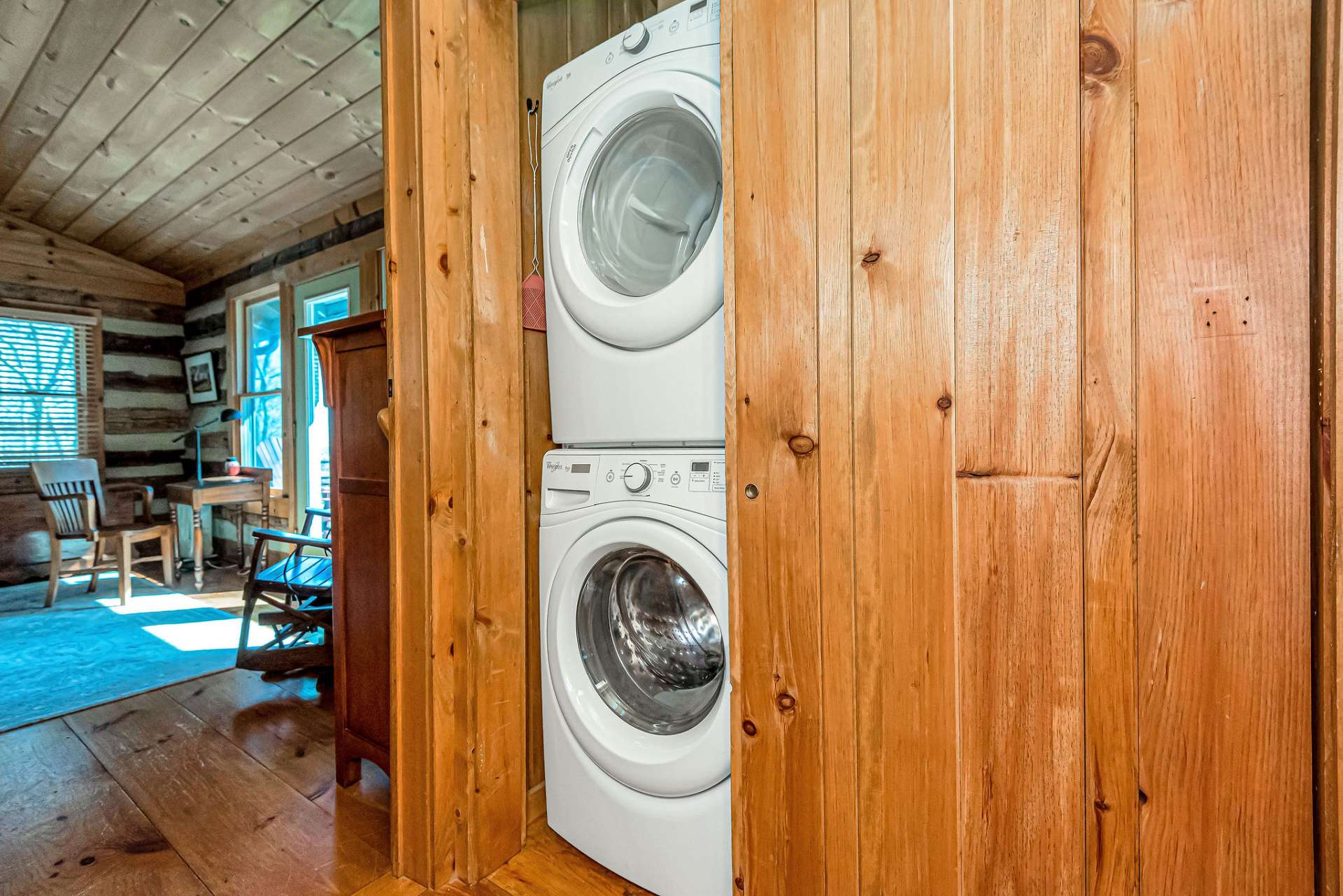 The laundry closet is conveniently located in the hall and offers additional storage.