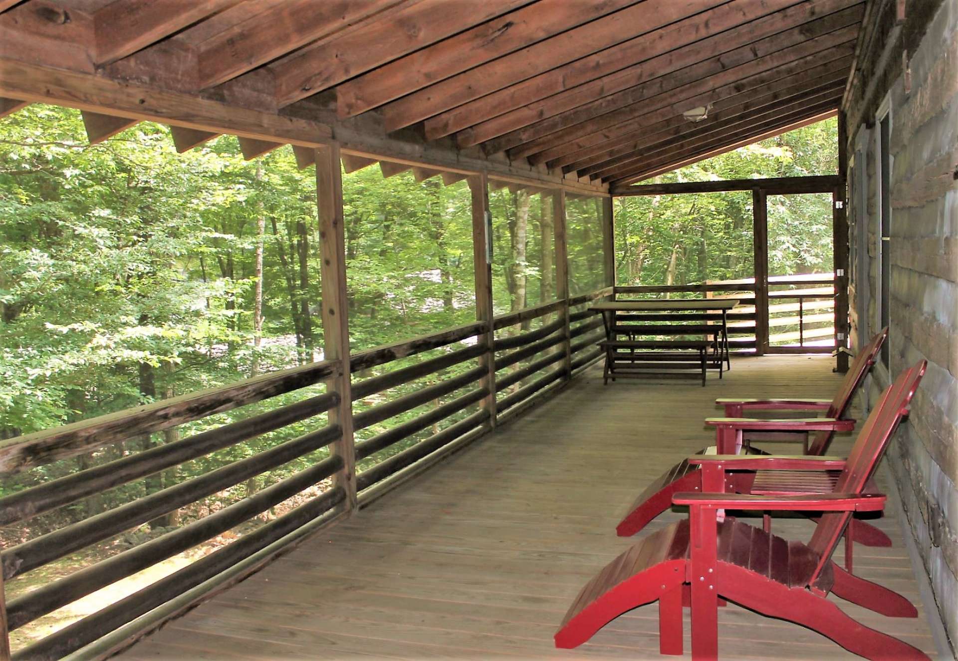 I would guess that you will spend most of your time entertaining family and friends on this spacious covered and screened porch where you can host fabulous parties or simply relax and listen to the babbling creek.