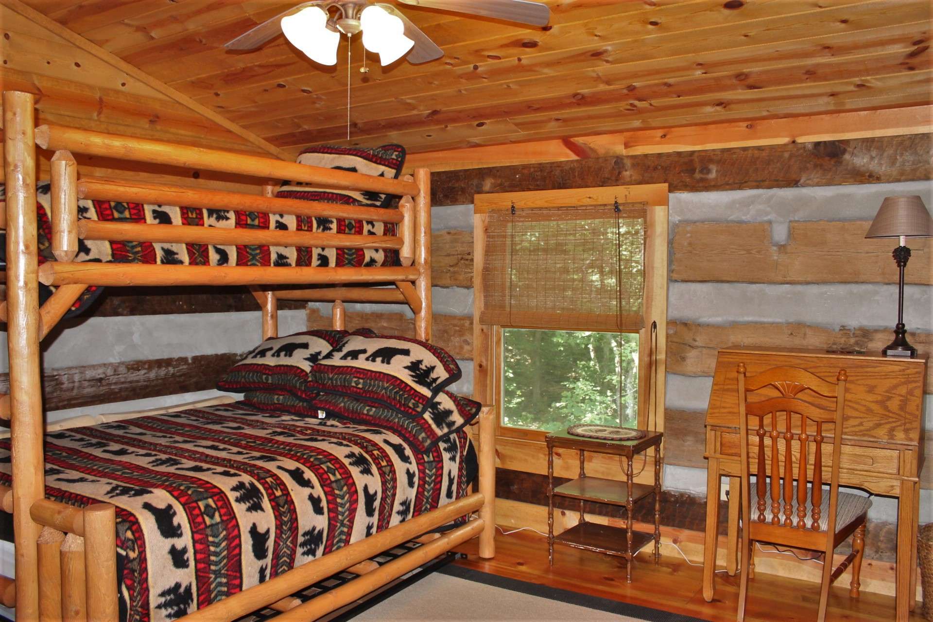 On the upper level, the loft has been enclosed to allow privacy for overnight guests.
