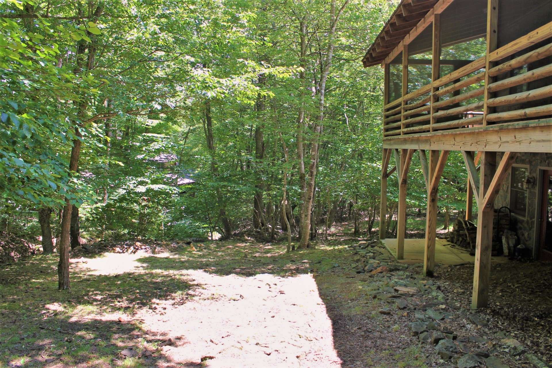 The side yard is level and could easily accommodate a fire-pit or perfect play area for pets and children.