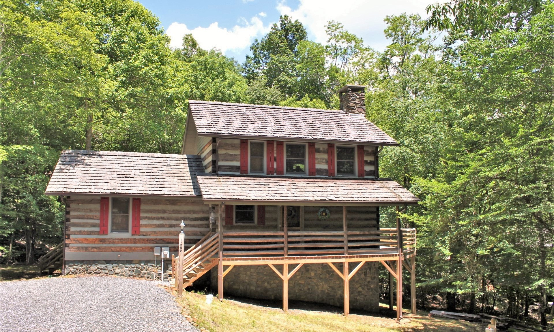 Offered at $325,000, this antique log home located in the Stonebridge  community in the Todd area of Southern Ashe County in the North Carolina Mountains will be a great choice for your mountain retreat or primary residence.  M137