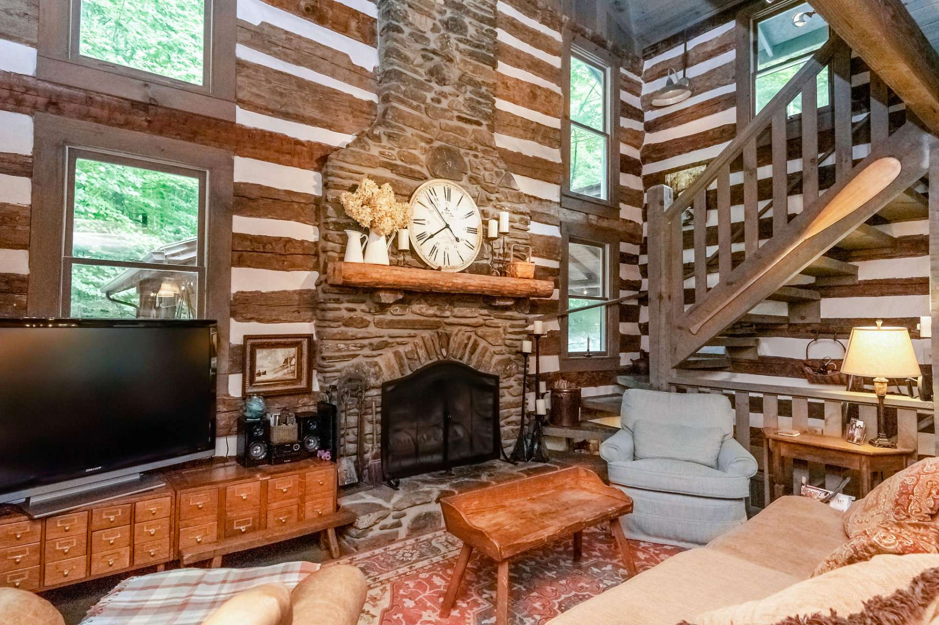 Stay cozy and warm in front of this 2 story native stone wood burning fireplace.