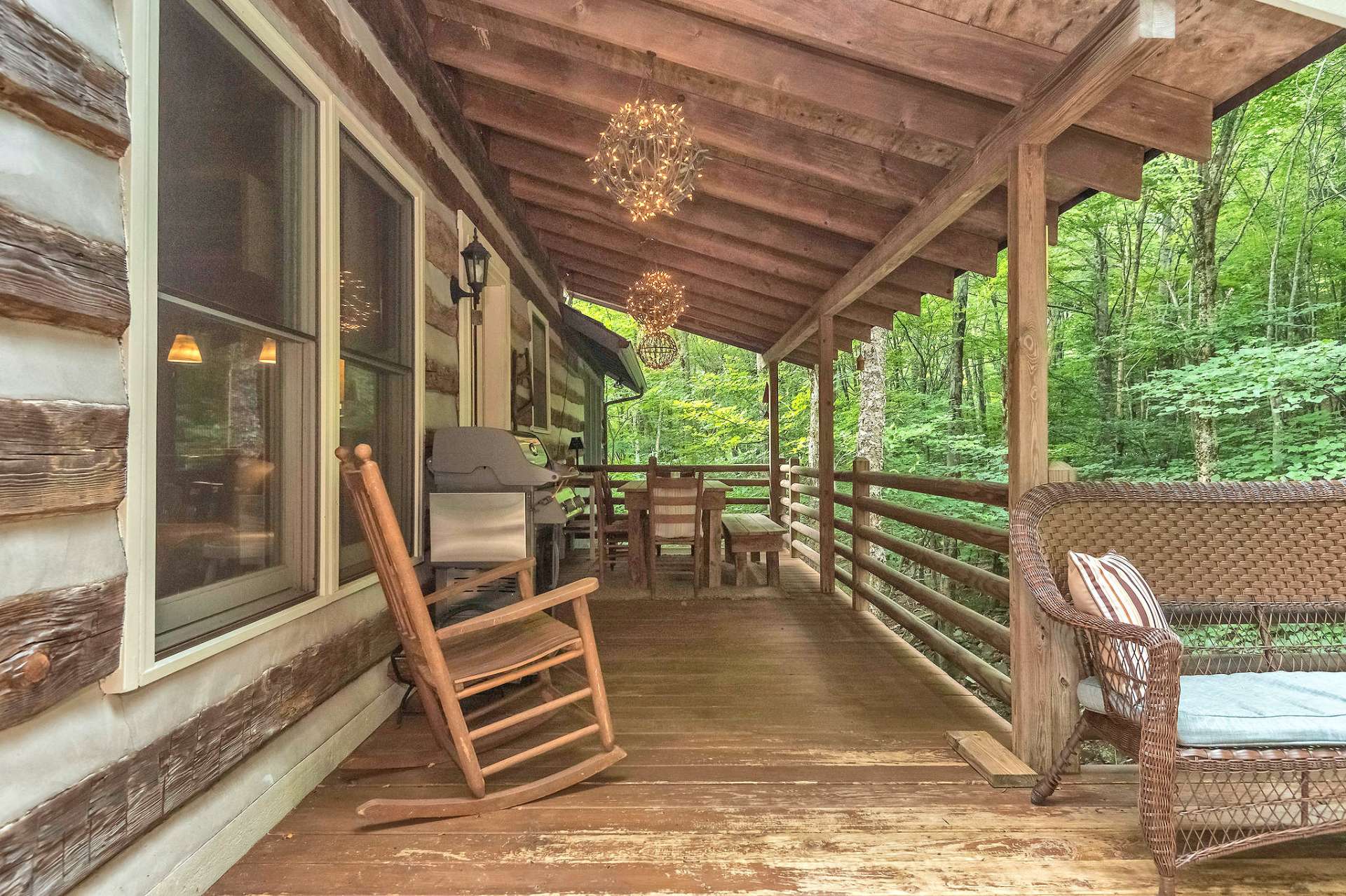 The rain won't dampen your plans to enjoy an outdoor dinner with this covered dining area.
