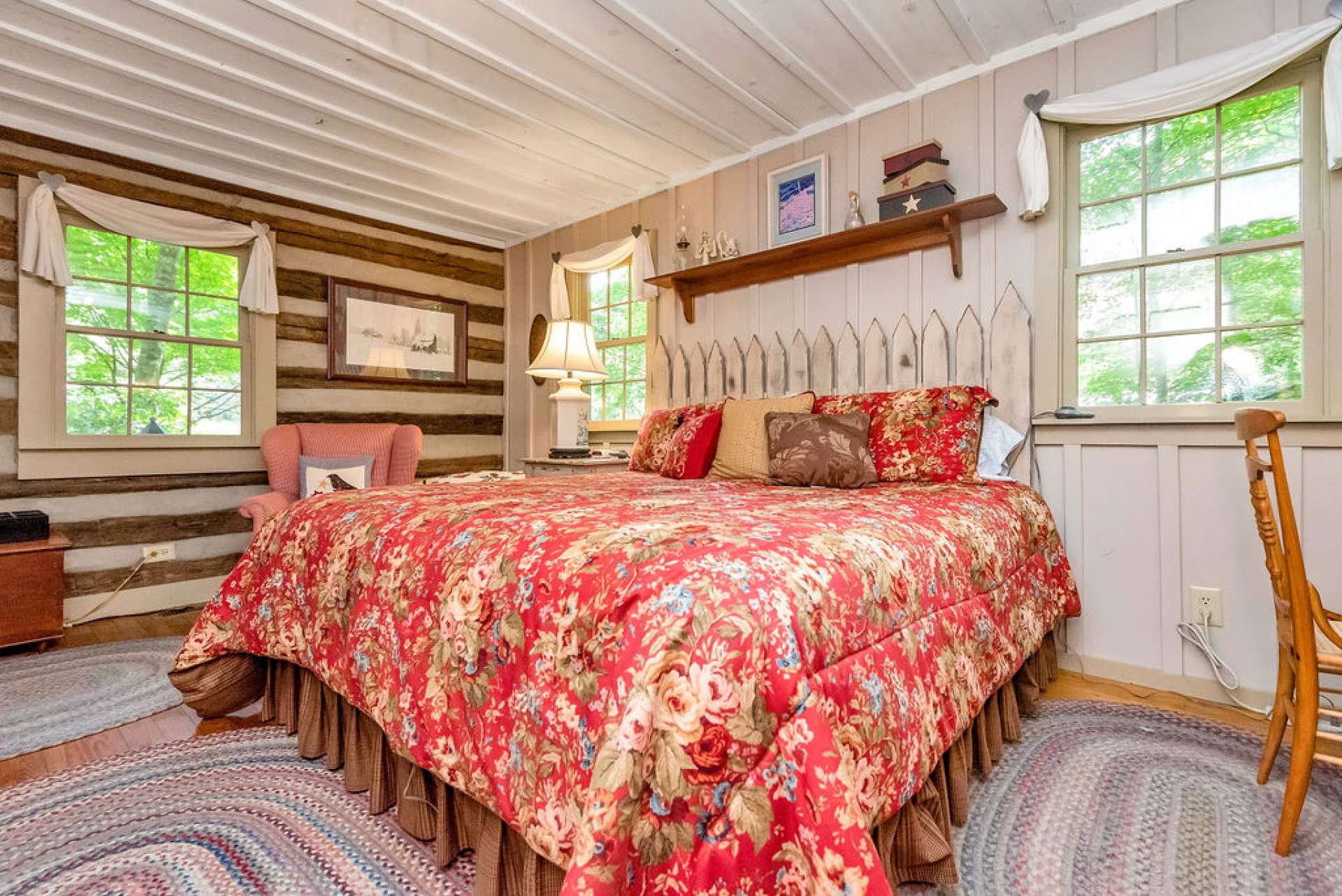 The board and batten compliment the logs and add a country charm to the room.