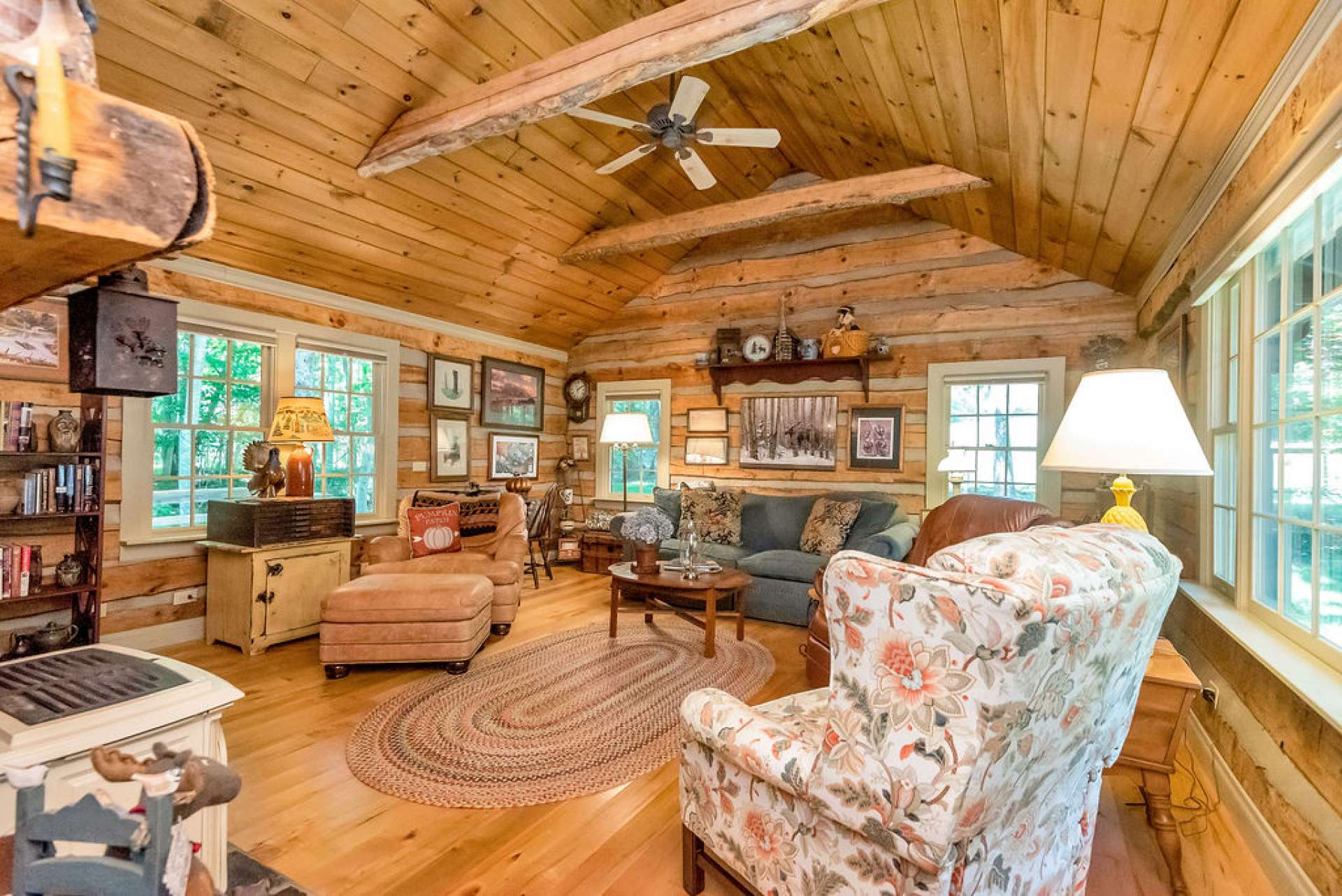 The warm and inviting family room features live edge beams, adding another level of mountain charm.