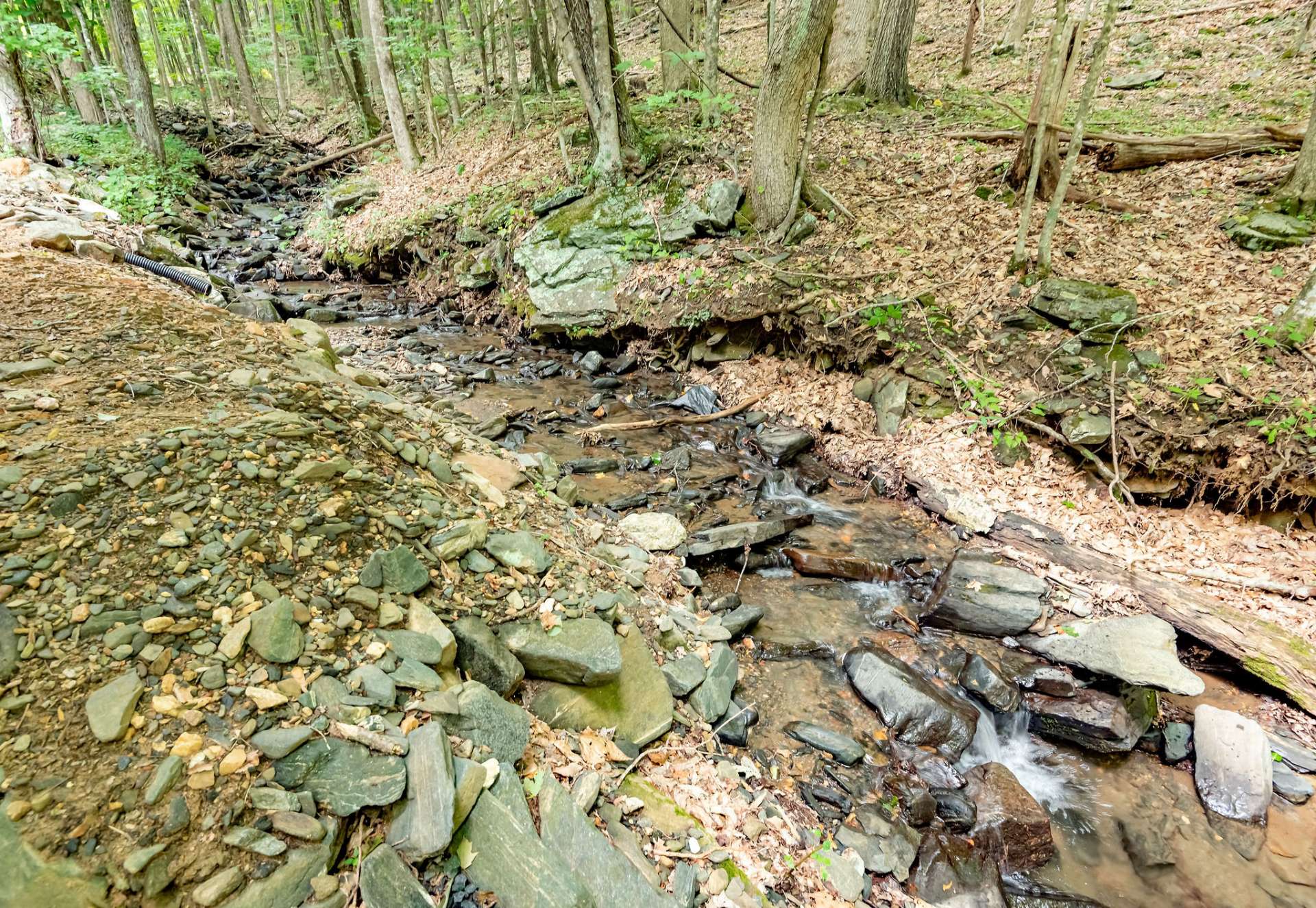 Enjoy a peaceful afternoon relaxing on the porches and deck listening to the sounds of Falls Creek.