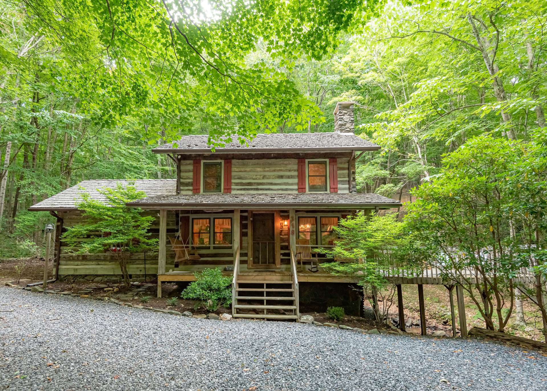 This charming  Creekside Stonebridge log cabin is offered mostly furnished.  Welcome home to your NC Mountain retreat or primary home.