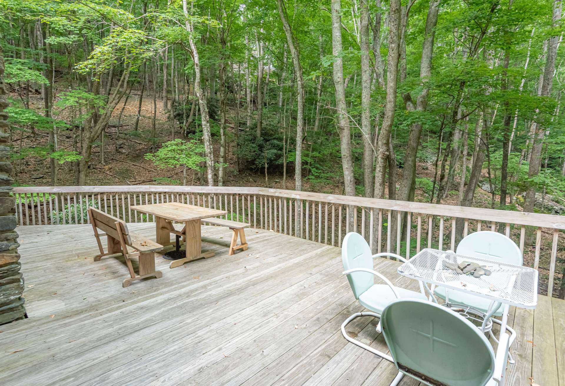 In addition to the covered front porch, this large open deck space provides lots of outdoor entertaining space.