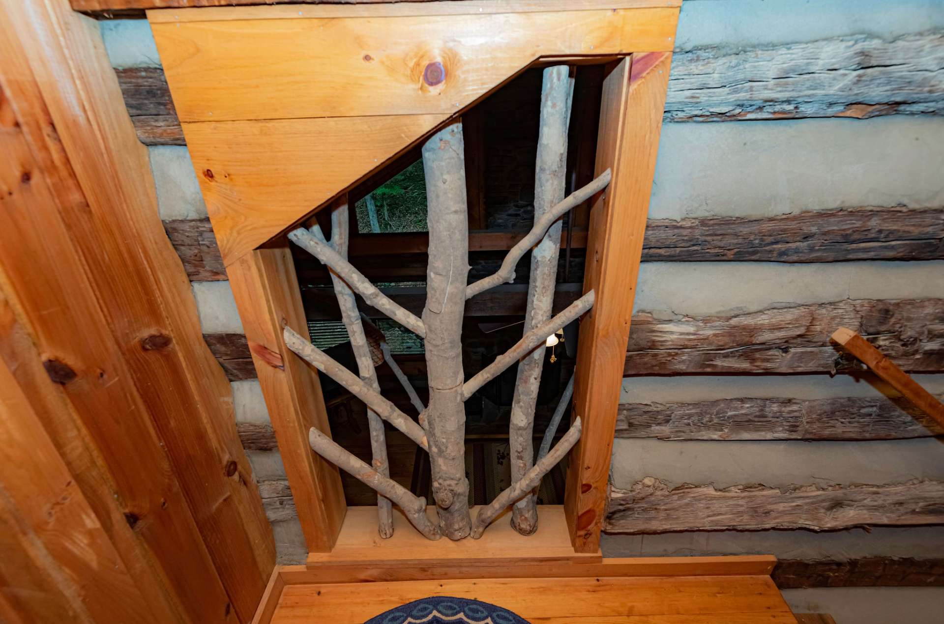 Notice these rustic features that add to the log cabin feel.