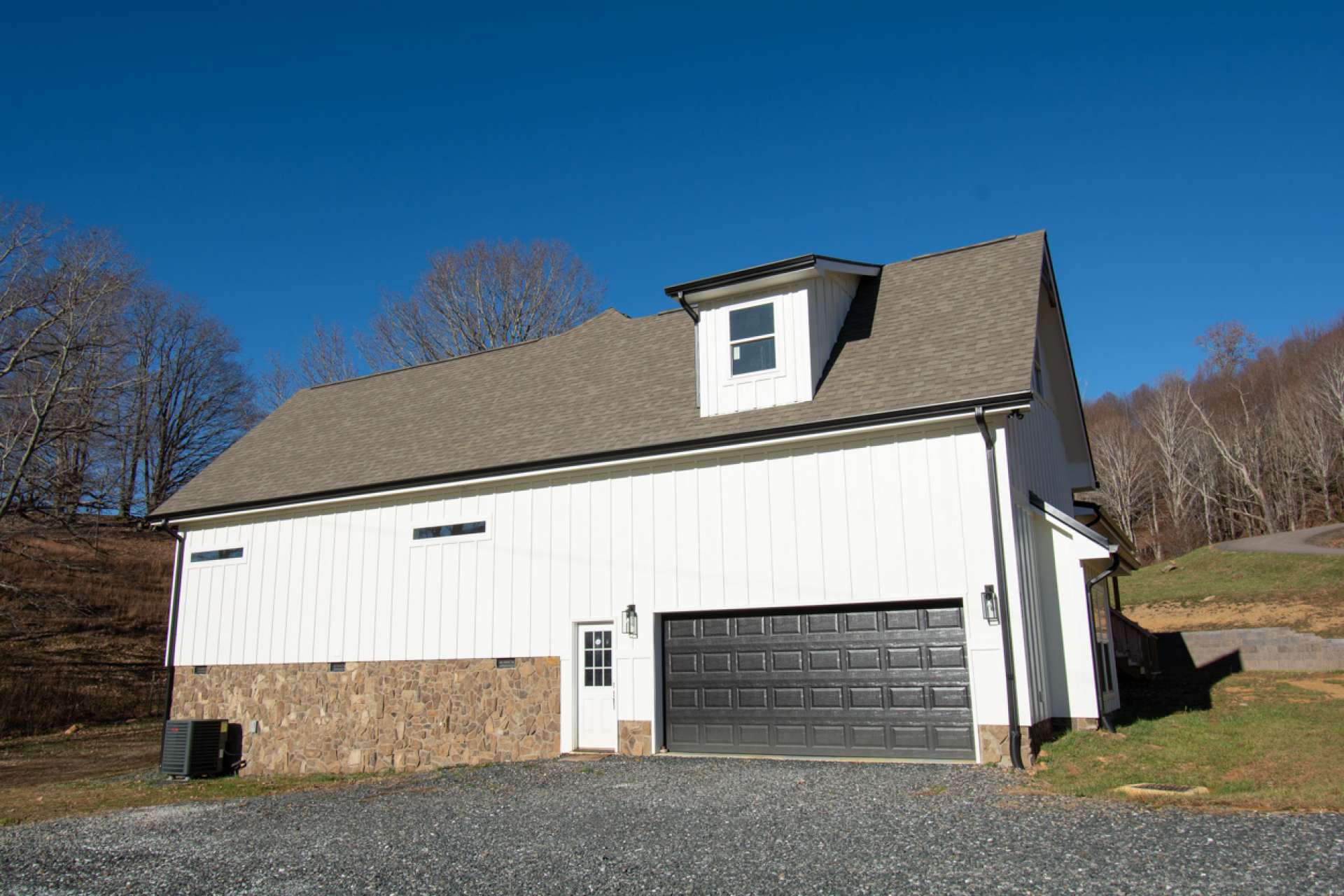 Convenient 2-car garage with storage above.