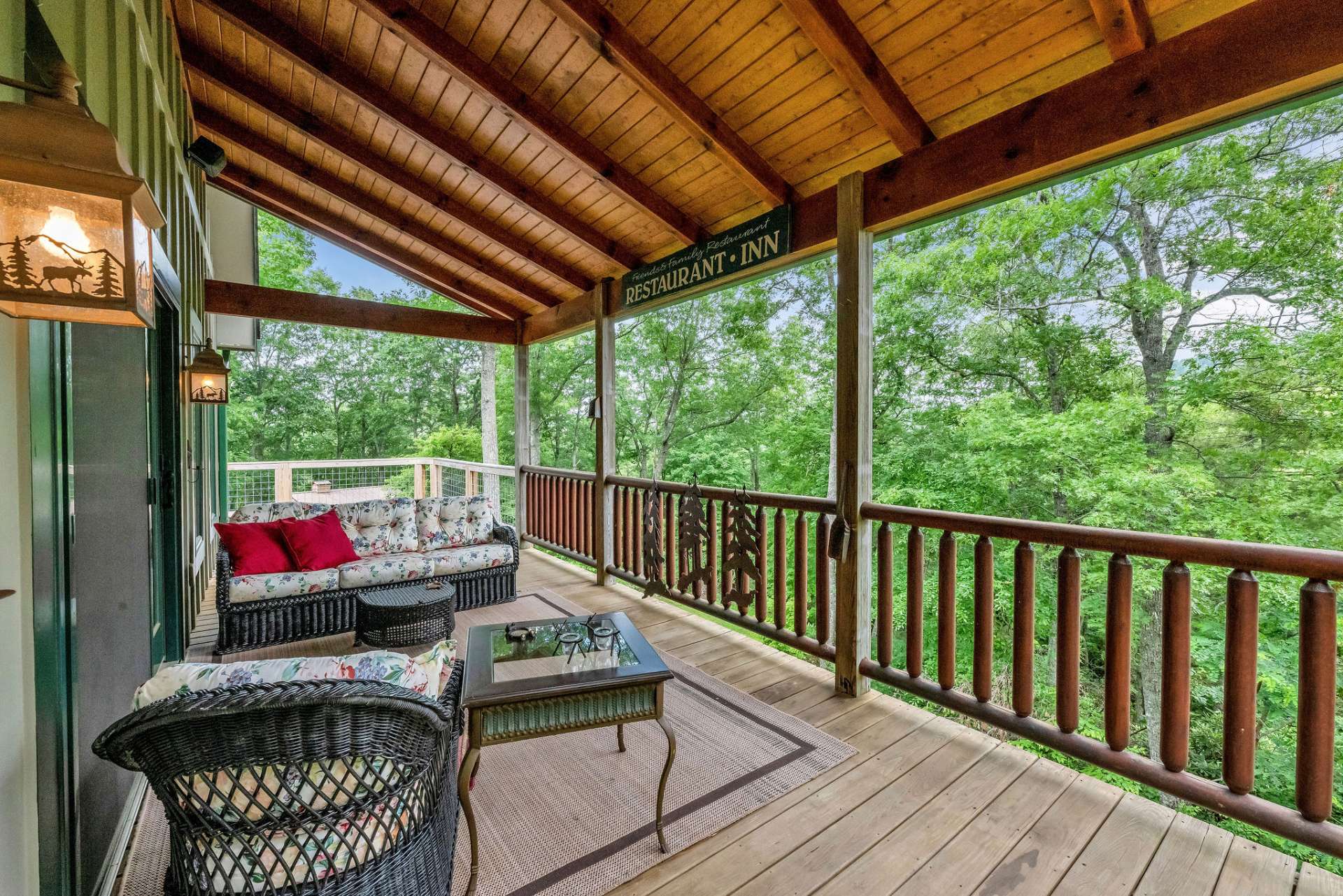 Covered deck area with comfortable seating.