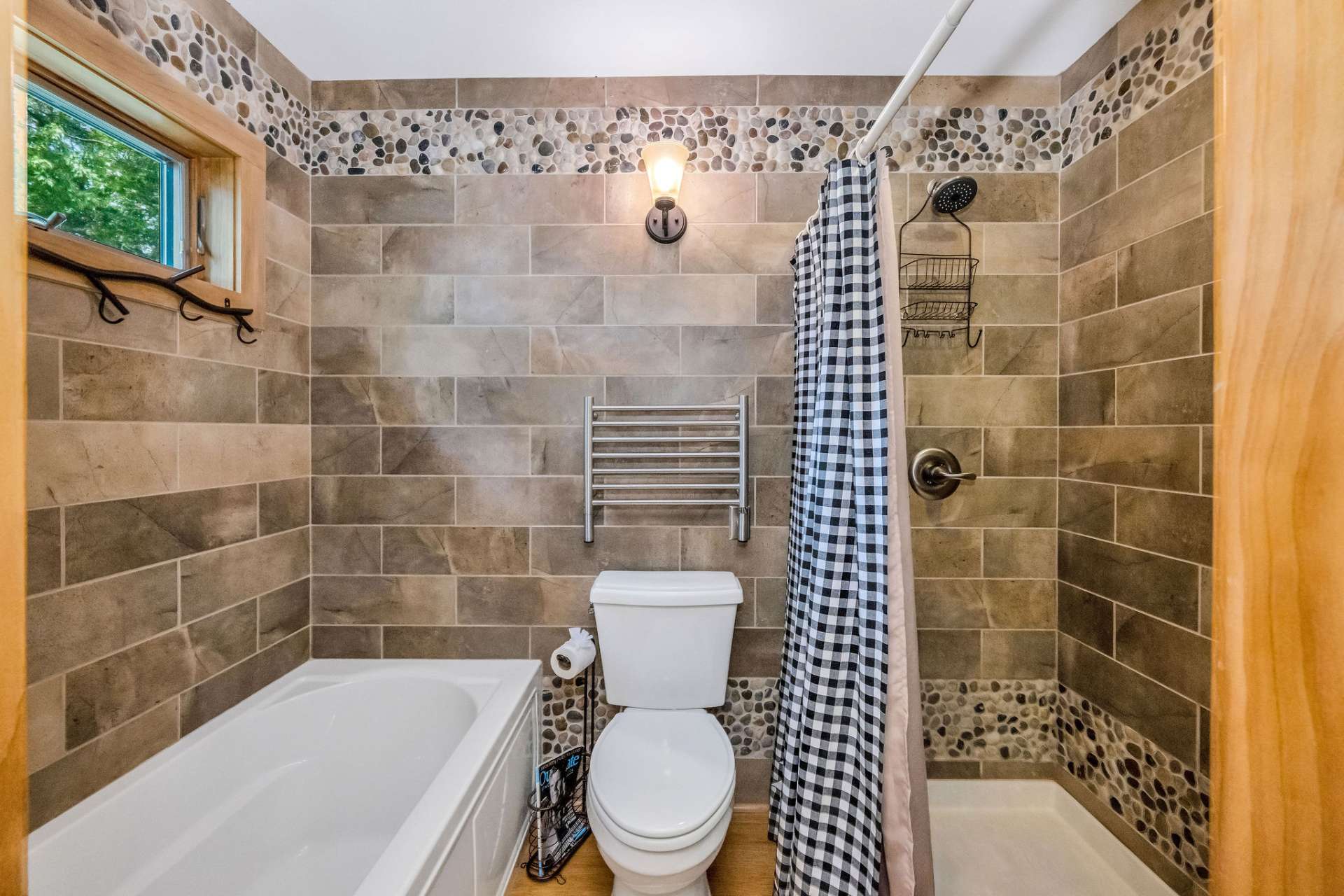 Second-level bathroom with shower and separate tub.