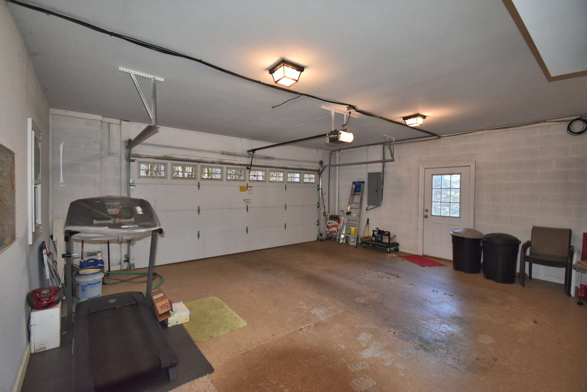 An oversized 2-car garage with Mechanic's room and tons of space for storage is also on the lower level.