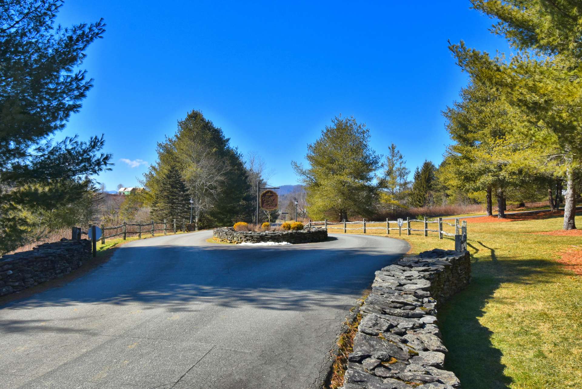 A beautiful stacked stone entrance sets the tone as one drives into the Village, a gated community with paved roads, underground utilities, a riverfront park and dedicated walking trails open to all that call the Village home.