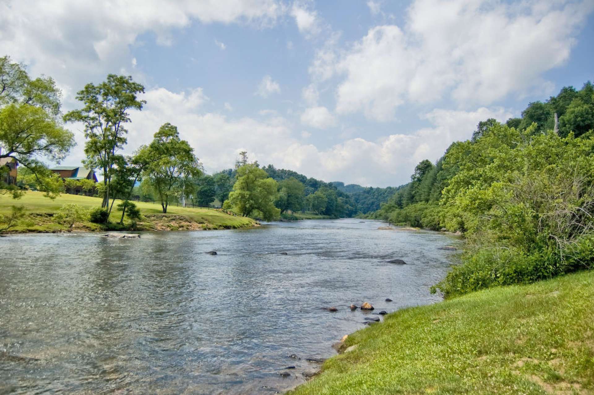 When you leave the main road, you will follow the South Fork of the New River for a mile or so down stream to an up-scale community across the river from Jefferson Landing Golf Club call "Village on the New." A sense of community often lost in modern day life is recreated in "Village on the New." Here you will find spectacular settings in pine forests and hardwoods with open meadows and ridge views of distant mountains and the historic New River flowing by.