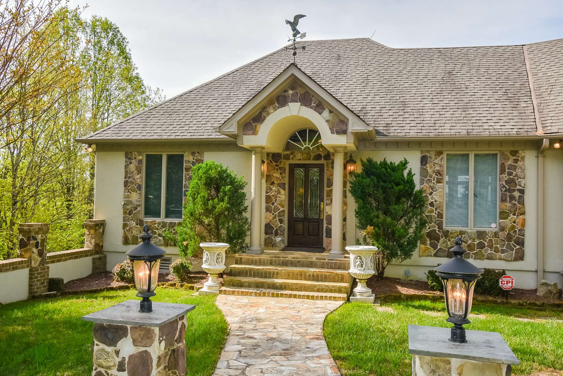 A lighted stone walkway welcomes guests. Many unique and custom details await you inside.