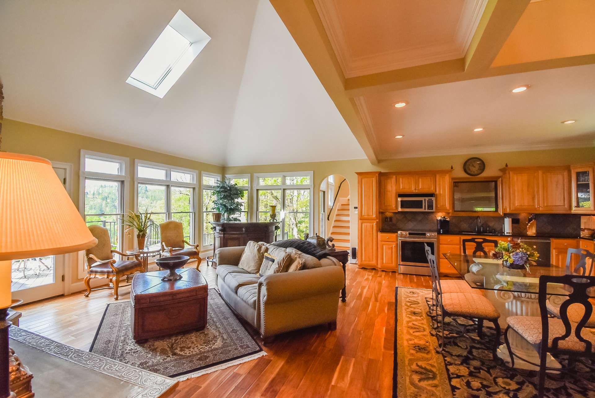 Another view of the great room showing all of the natural light that the windows and skylights bring to this space.