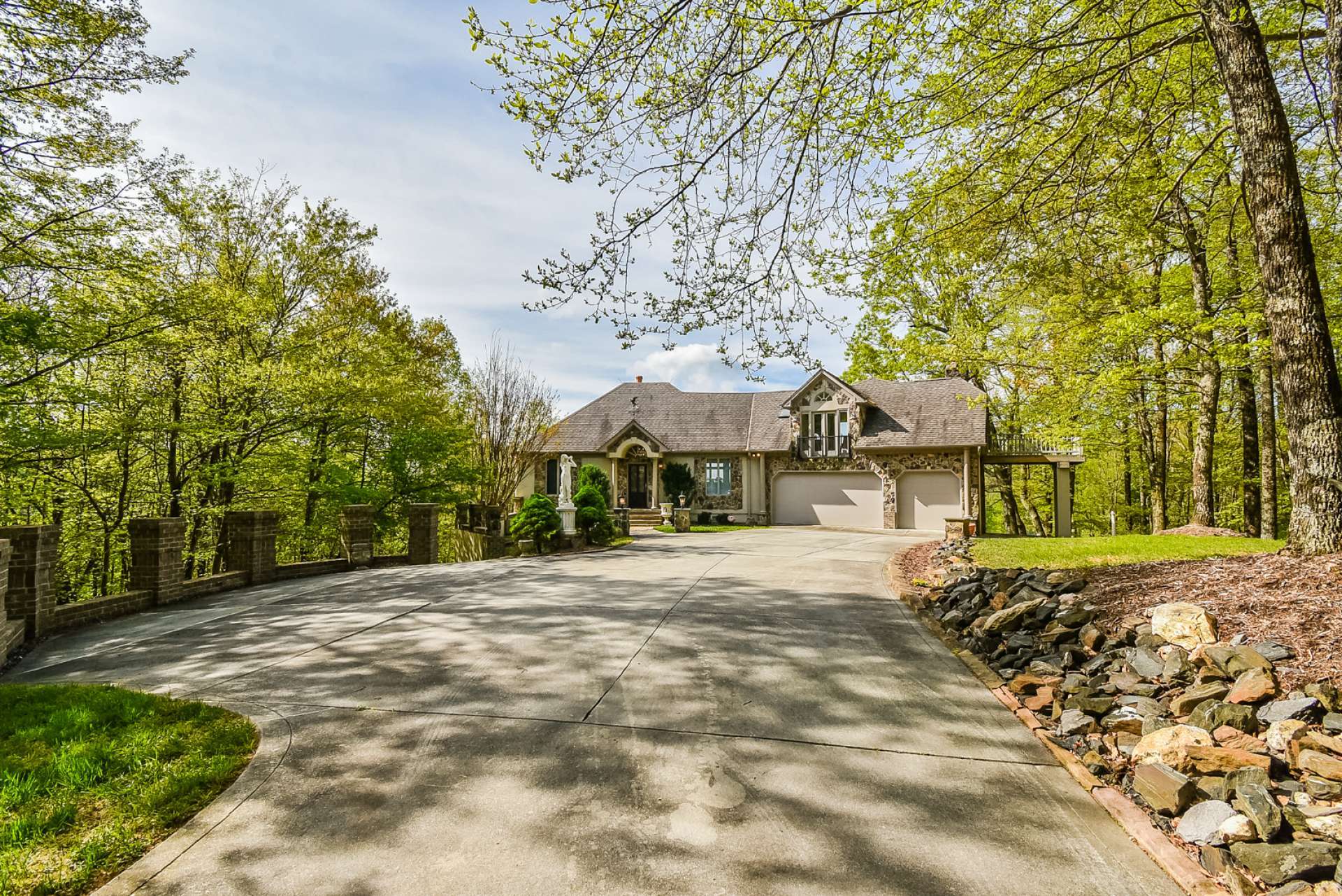 Notice the paved concrete driveway and additional parking space as you near the home. The attached 3-car oversized garage is convenient when arriving home after shopping.