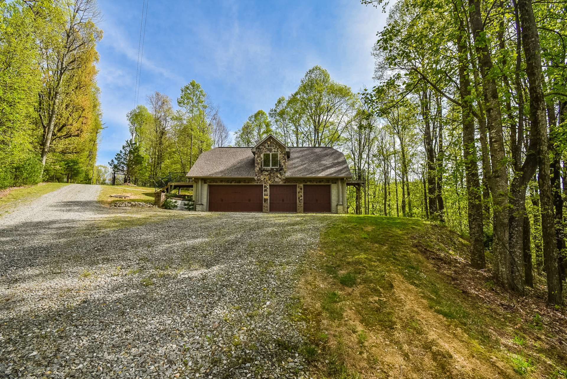 The detached 4-car garage features a 1 bedroom, 1-bath apartment above. Perfect for overnight guests or extended family.