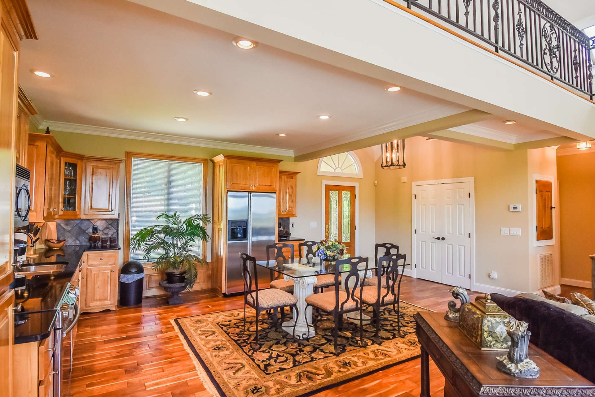 The kitchen features granite counters and stainless appliances.