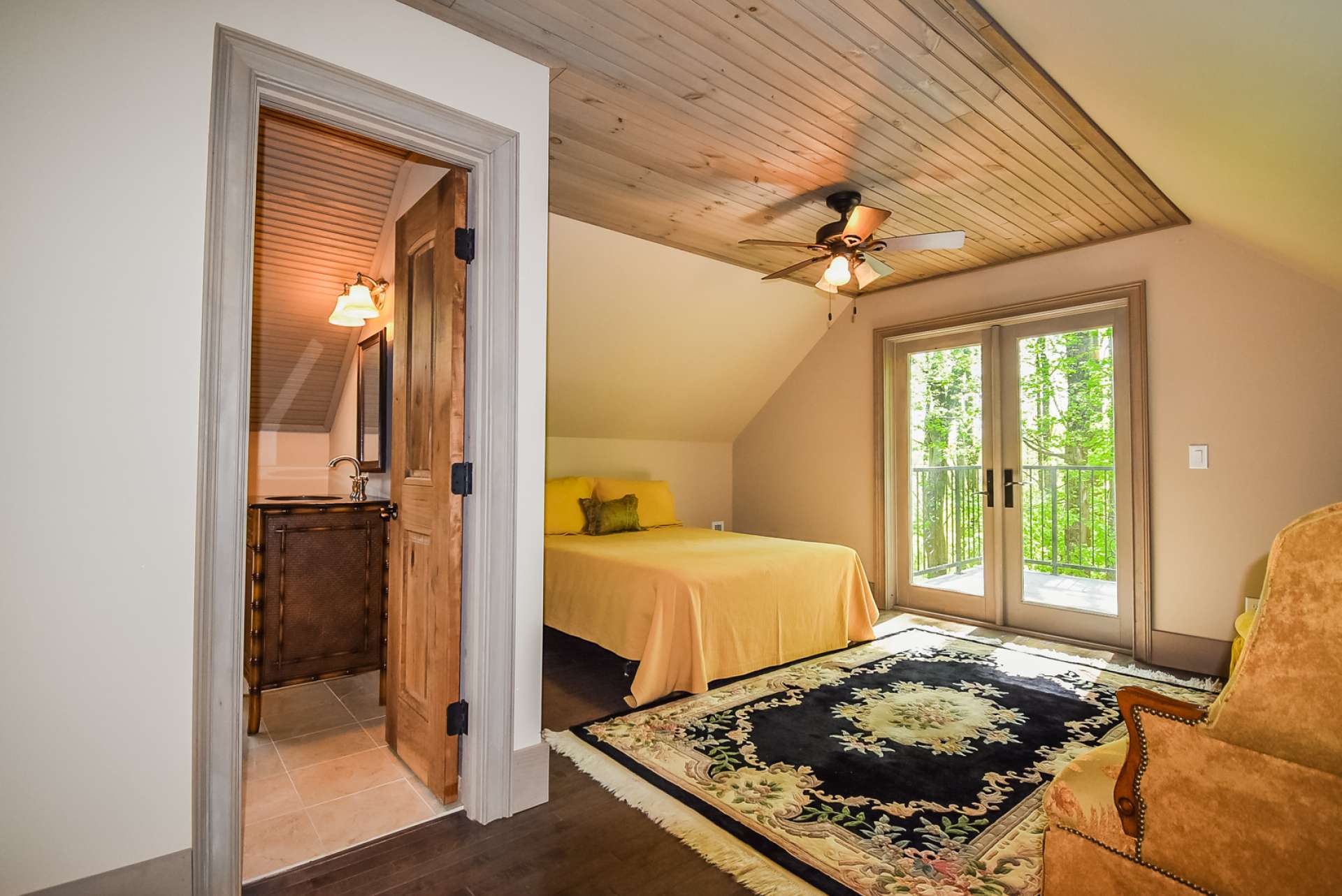 The apartment bedroom features access to a private deck. Your guests will enjoy their privacy.