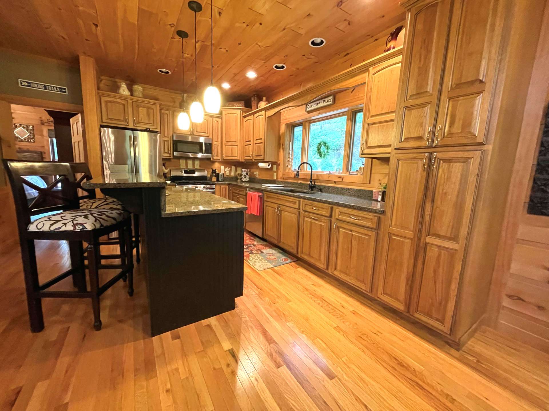 Kitchen includes a bar area.