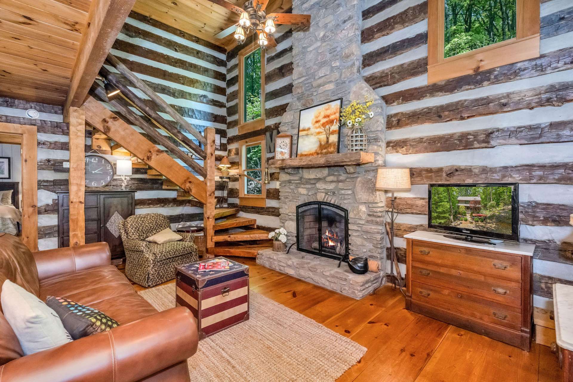 Enjoy the true log cabin living experience complete with a wood-burning stone fireplace.