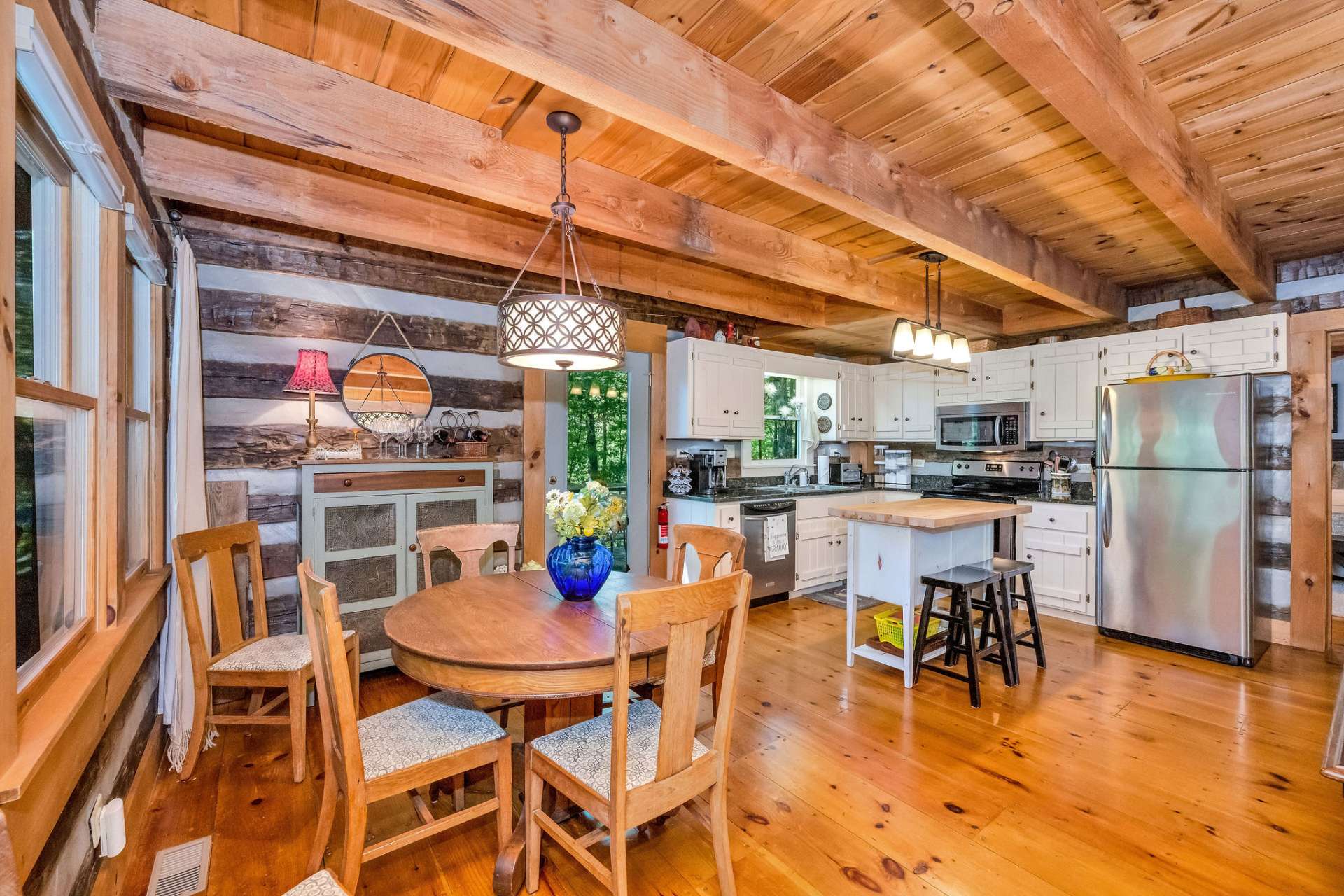 The dining area is positioned to enjoy the beauty of the outdoors while dining inside.
