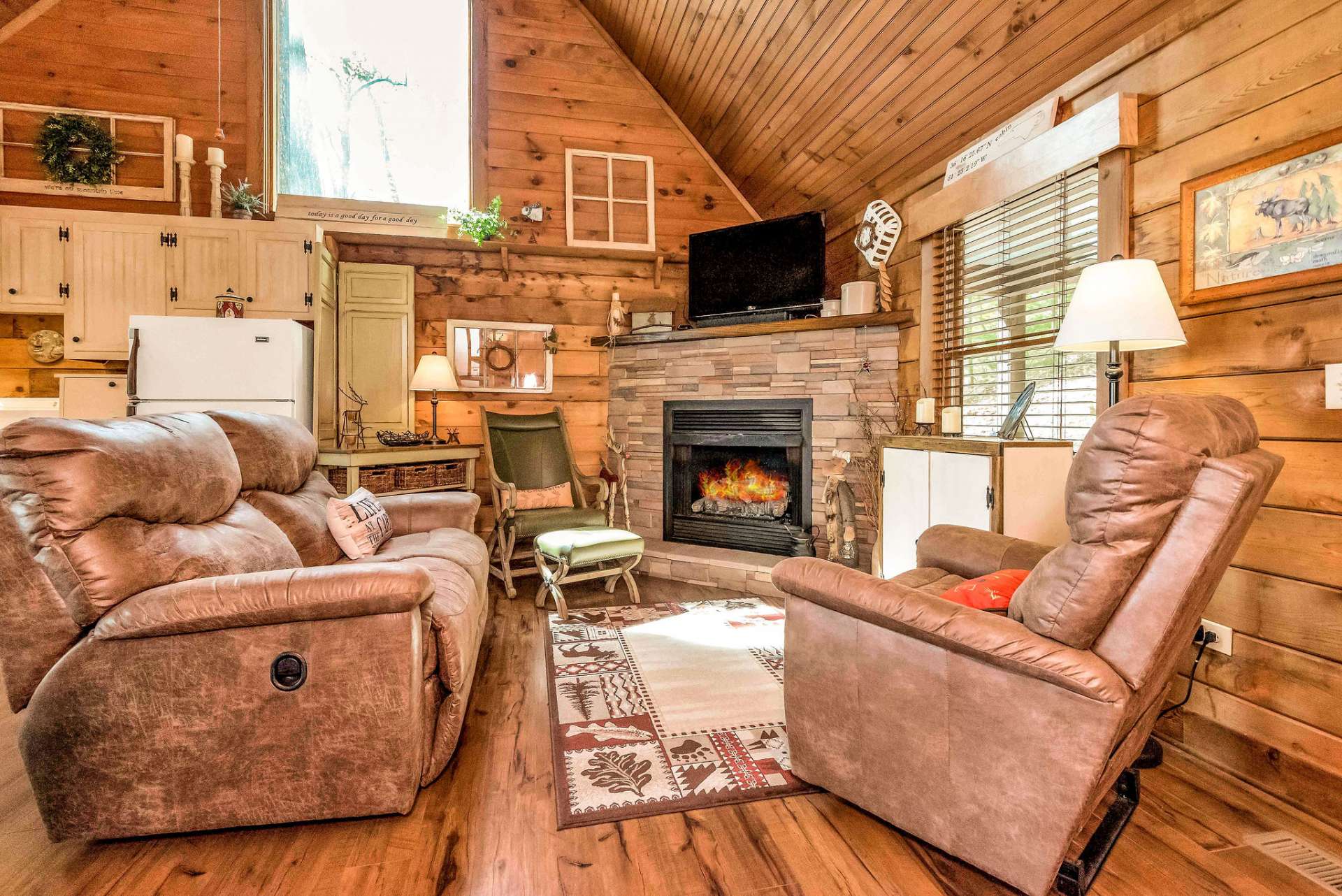 Comfortable furniture in the family room stays with the cabin.