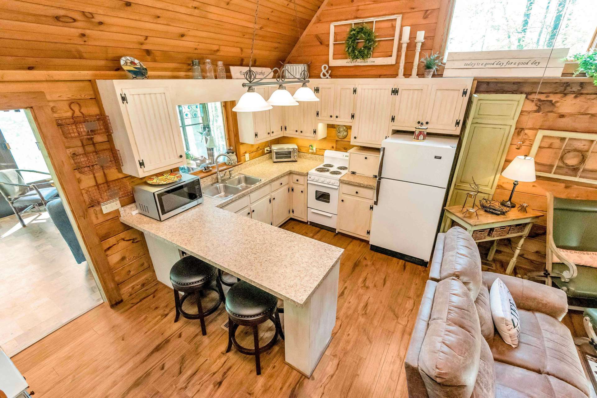 Well-appointed kitchen with island for dining.