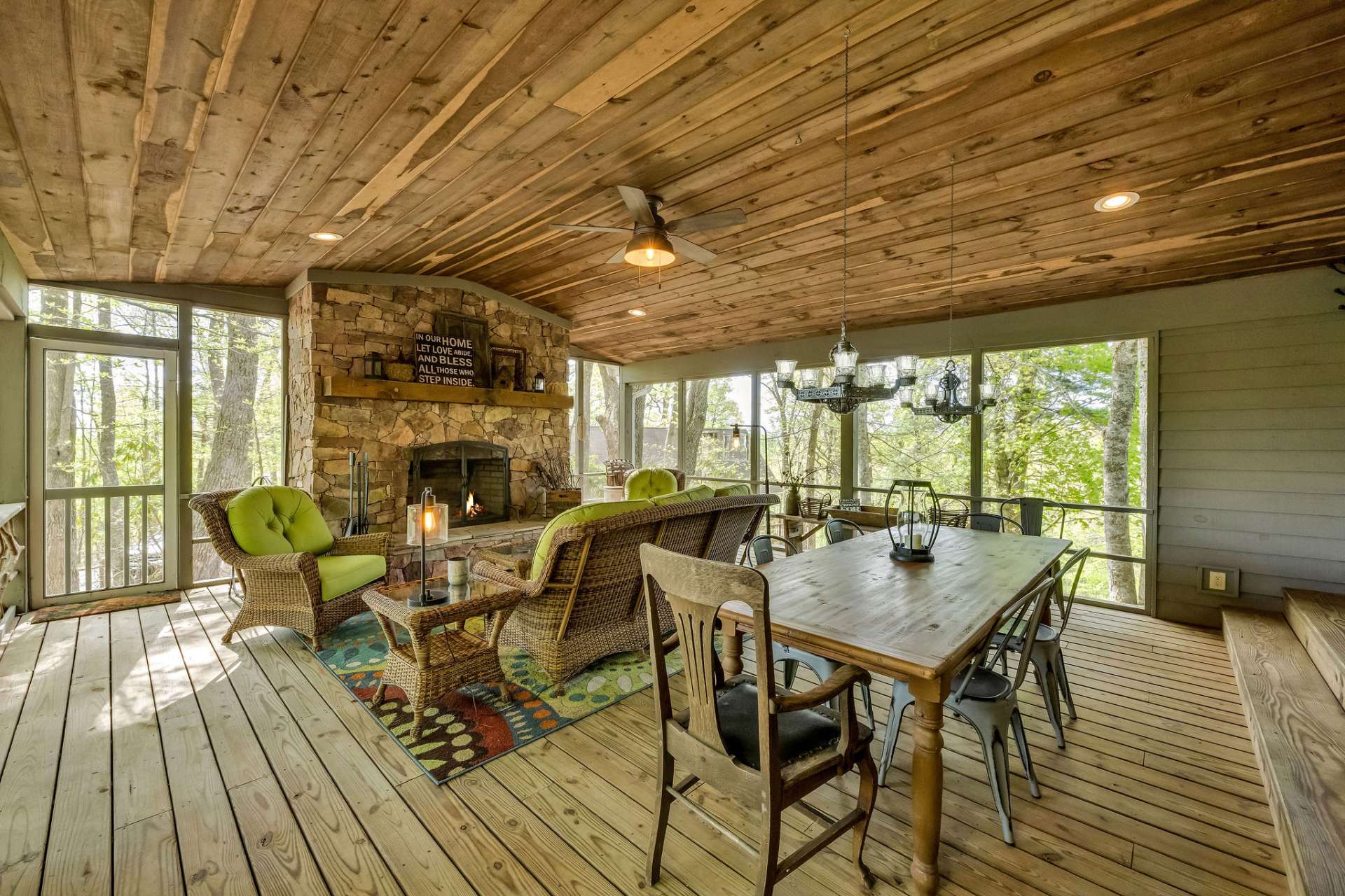 Relaxing screened porch with fireplace.
